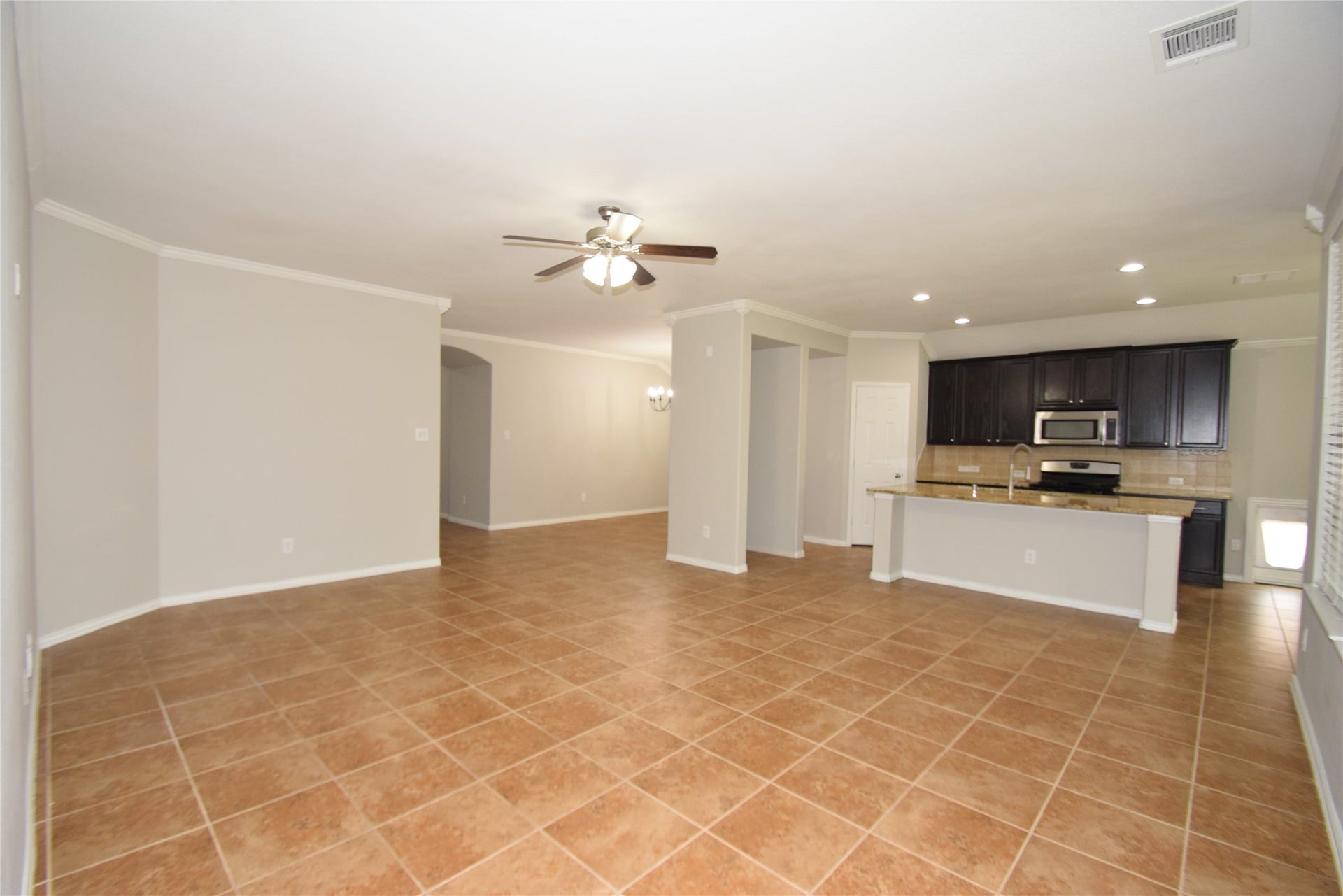 Enjoy another view of the family room opening to the kitchen.