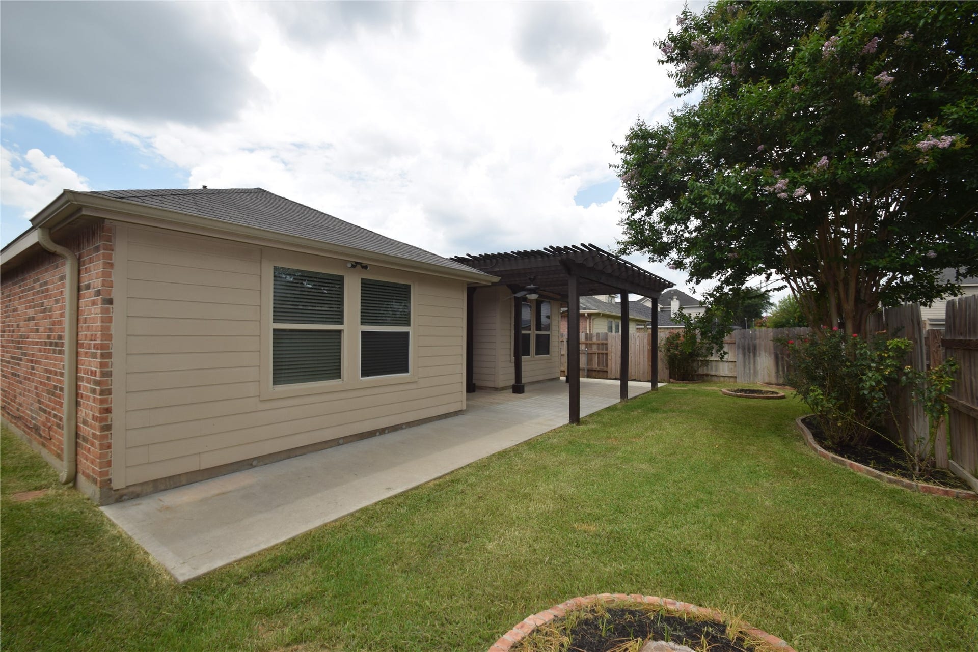 Back view of house showing the extended patio area.
