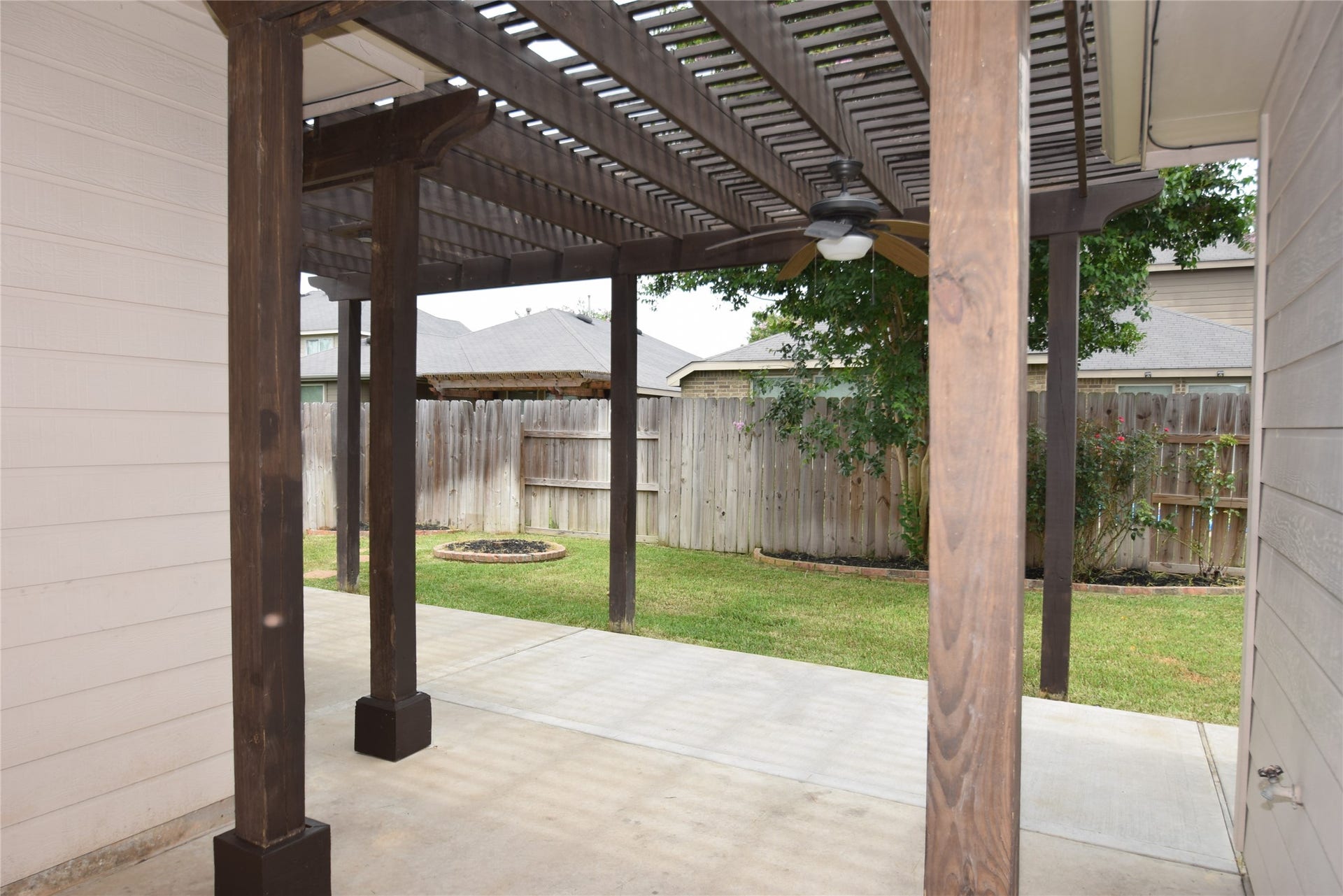 Patio area overlooking the fully fenced backyard.
