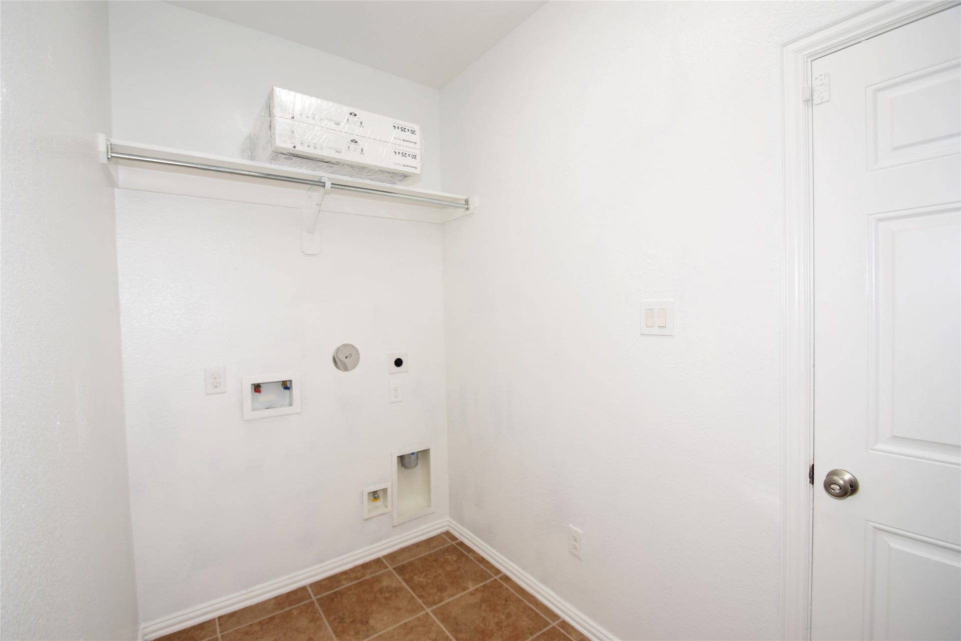 Utility room with access to the garage.
