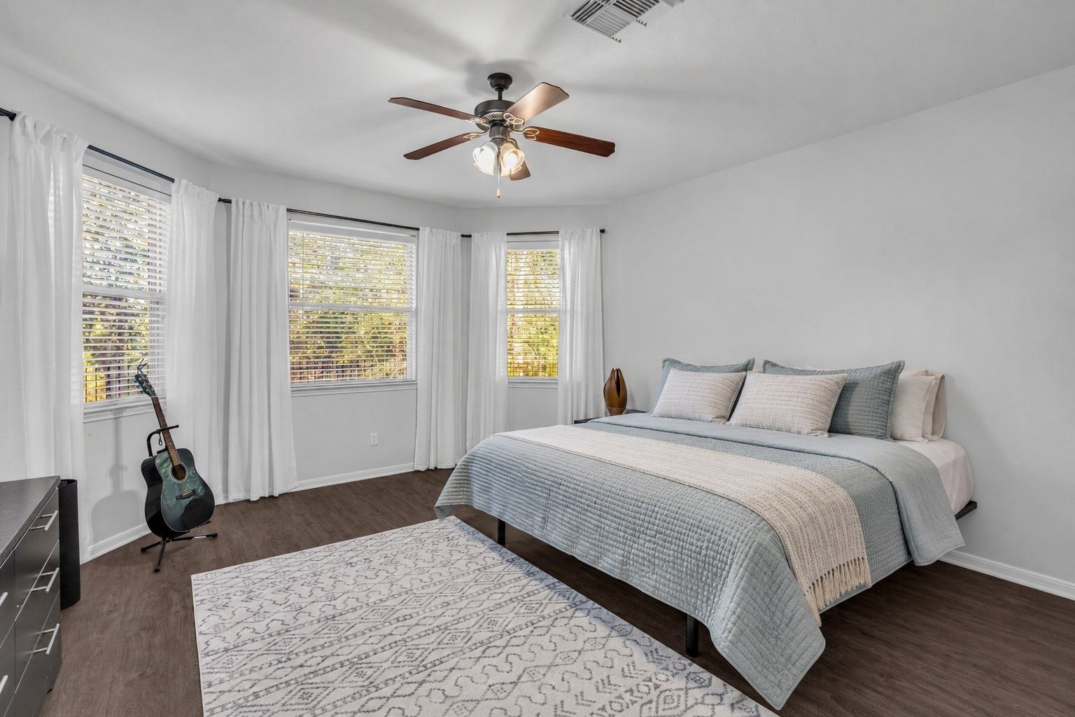 440 Magnolia Blossom, League City, TX 77573 Welcome to your primary bedroom.Spacious and a wall of windows to the nature preserve behind the home