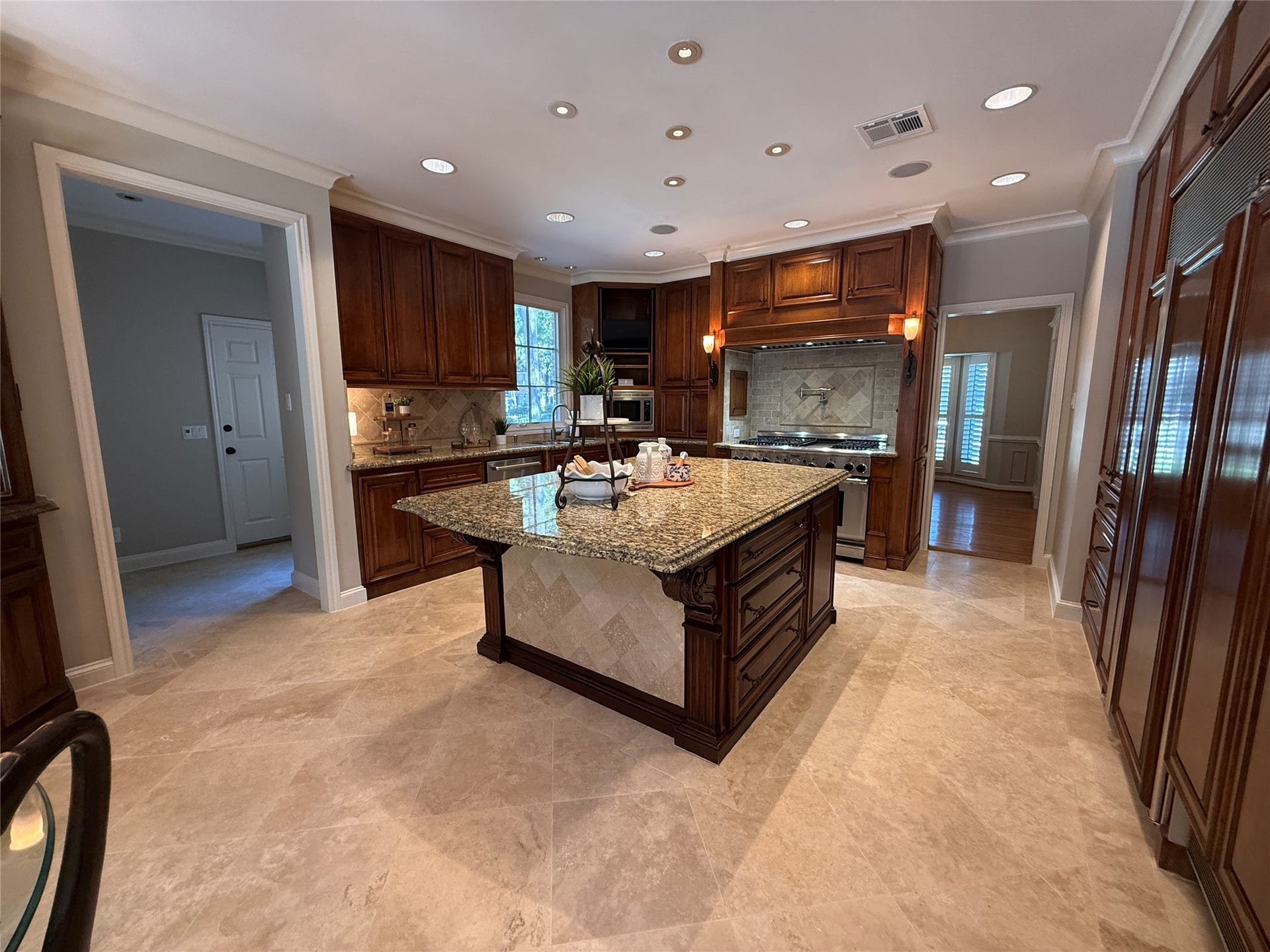 16131 Rudgewick Lane, Spring, TX 77379 Stunning kitchen with large granite island and Thermador range.