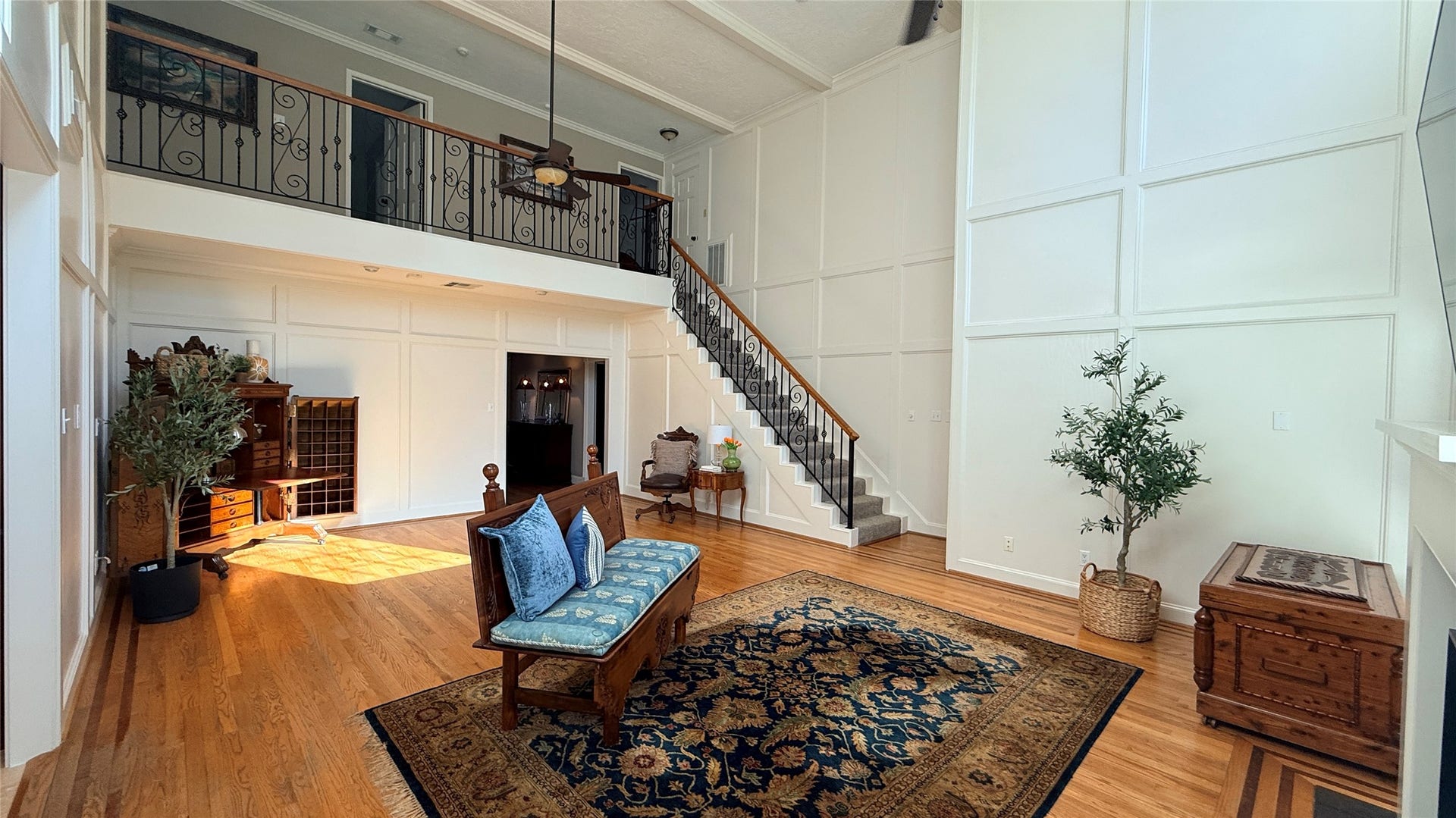 16131 Rudgewick Lane, Spring, TX 77379 Family room with wrought iron stair railing.