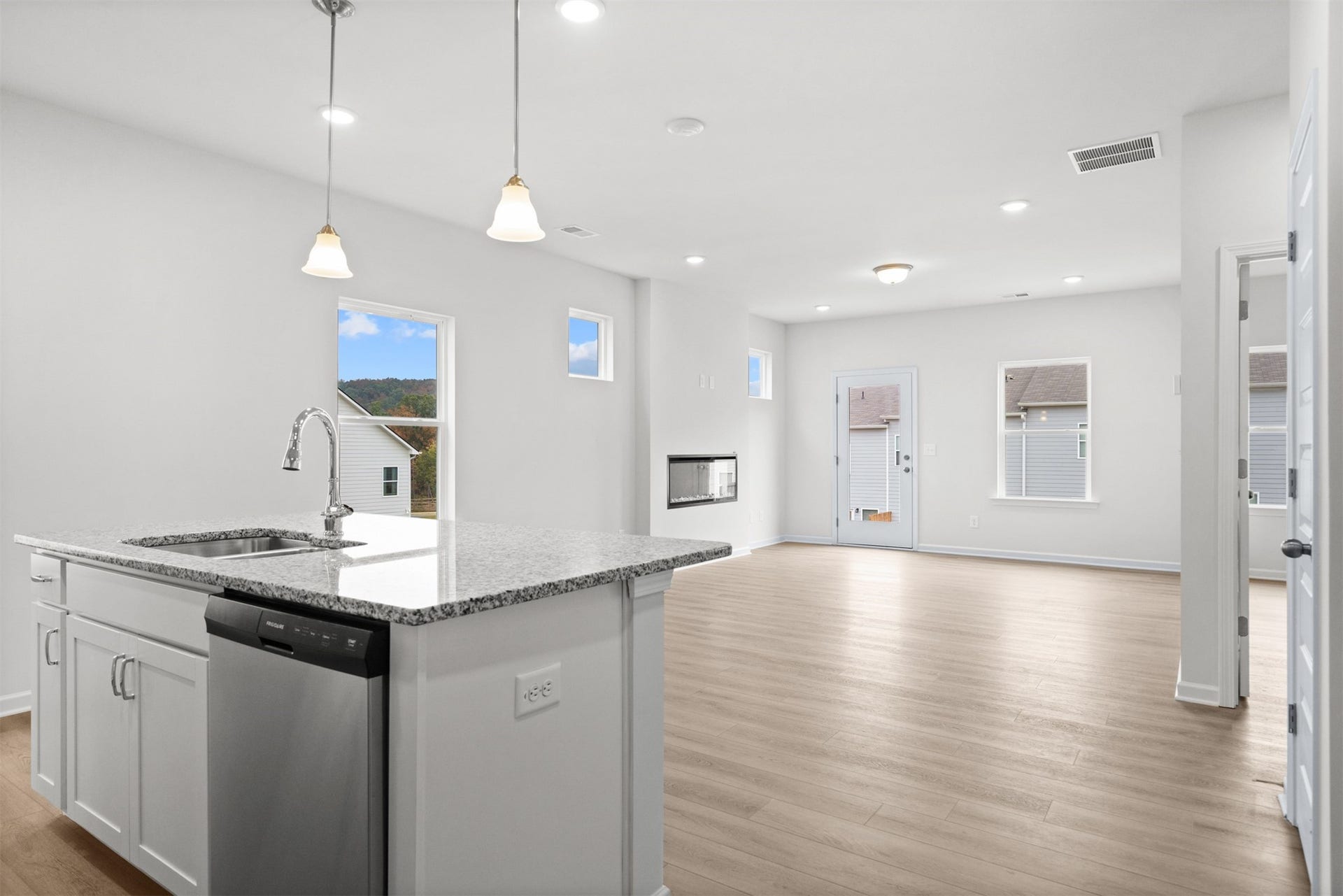 21835 Cypress Vine Drive, Splendora, TX 77372 The Dove- Kitchen into the Family Room. Home under construction, photo used for illustrative purposes only, colors and options will vary.