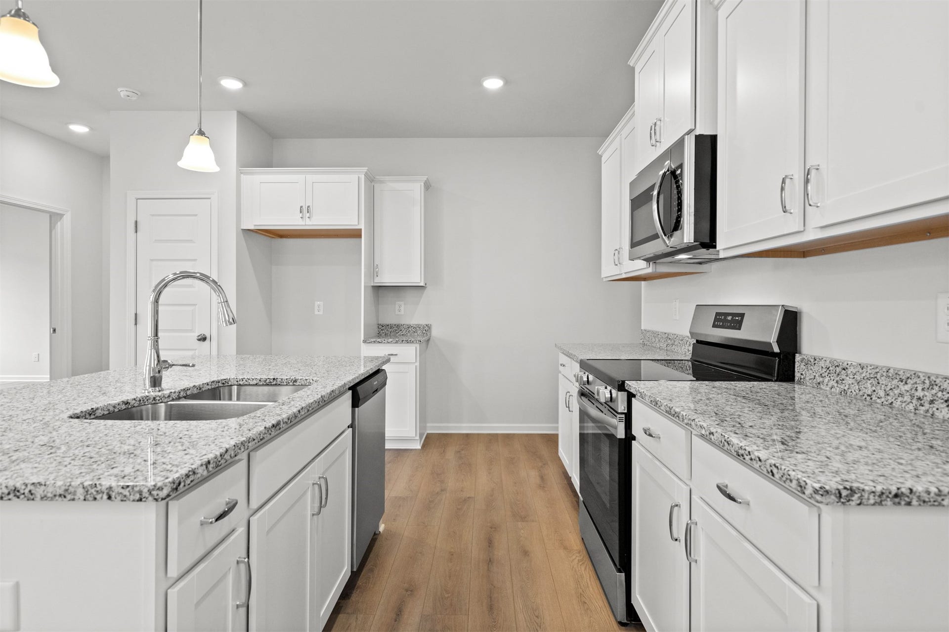 21835 Cypress Vine Drive, Splendora, TX 77372 The Dove- Kitchen. Home under construction, photo used for illustrative purposes only, colors and options will vary.