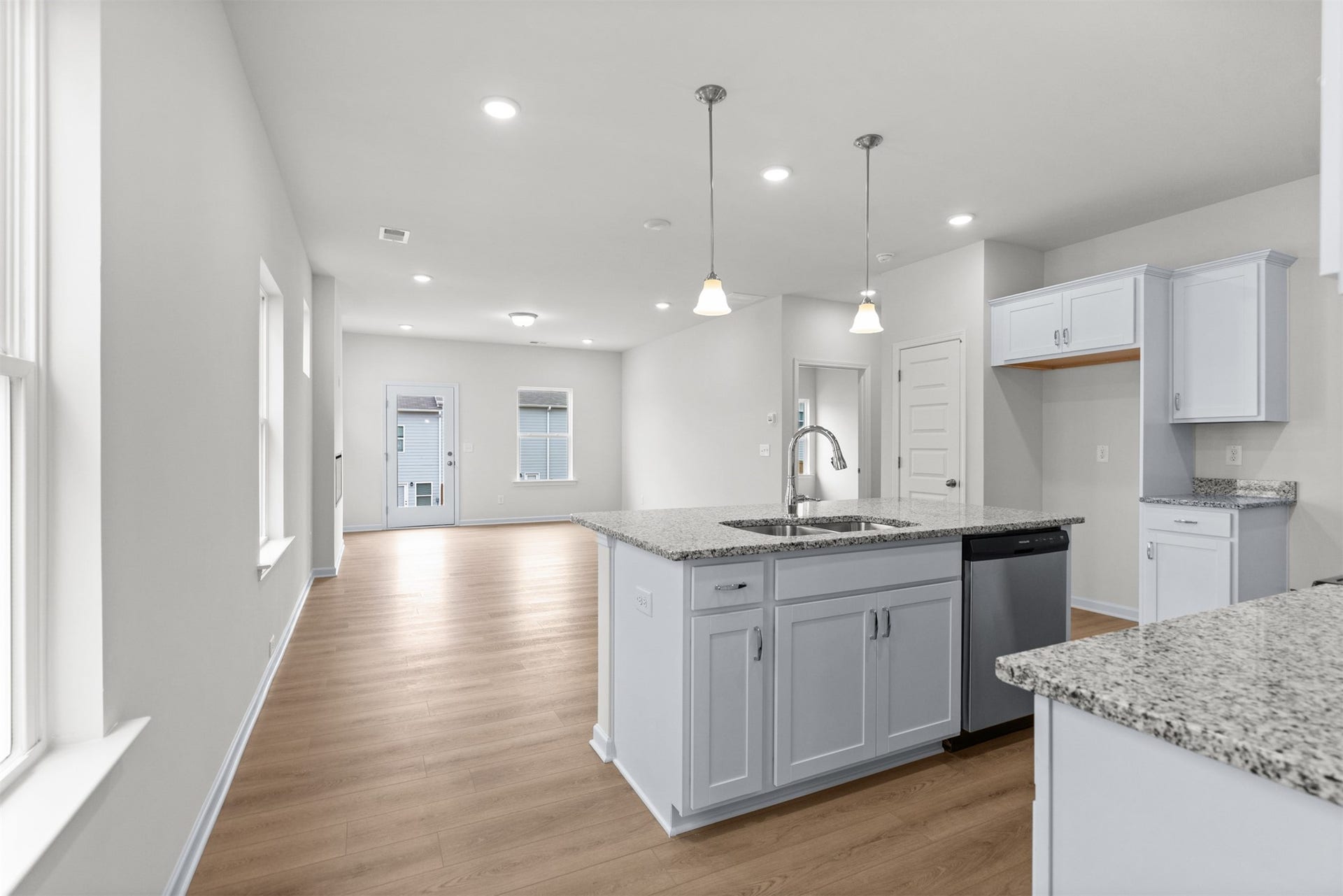 21835 Cypress Vine Drive, Splendora, TX 77372 The Dove- Kitchen into Family Room. Home under construction, photo used for illustrative purposes only, colors and options will vary.