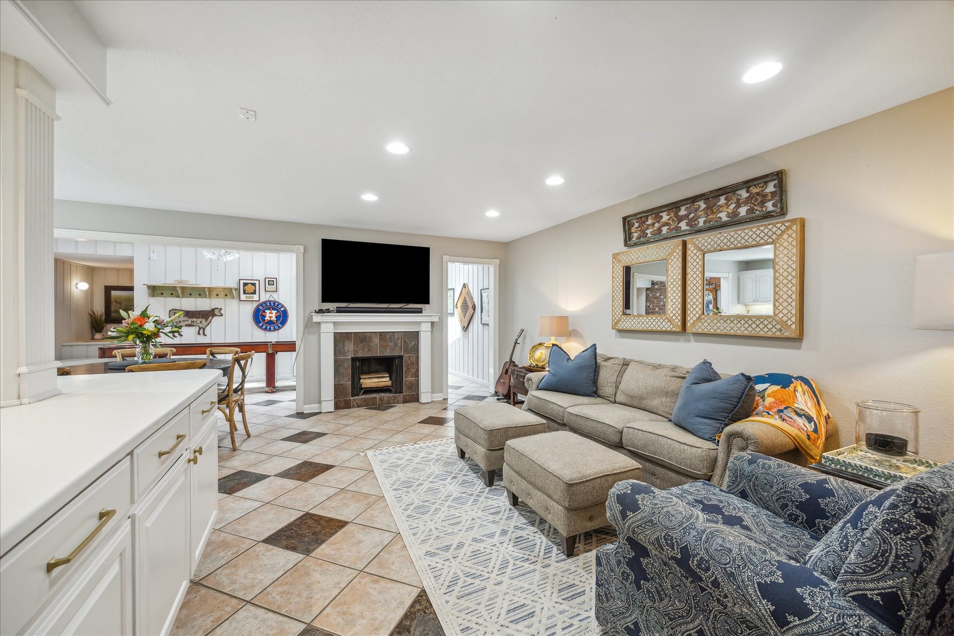 Cozy den with woodturning fireplace.