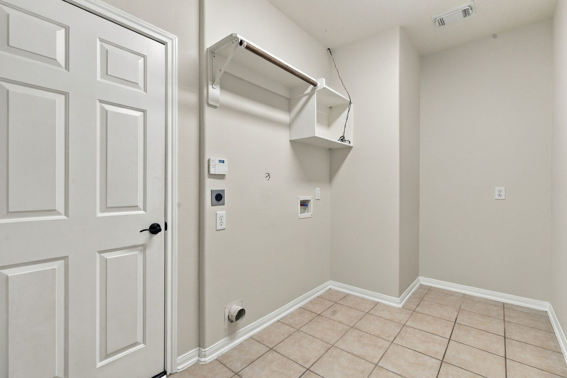 12843 Sherlock Acres Drive, Tomball, TX 77377 View of the laundry room with access to the garage.