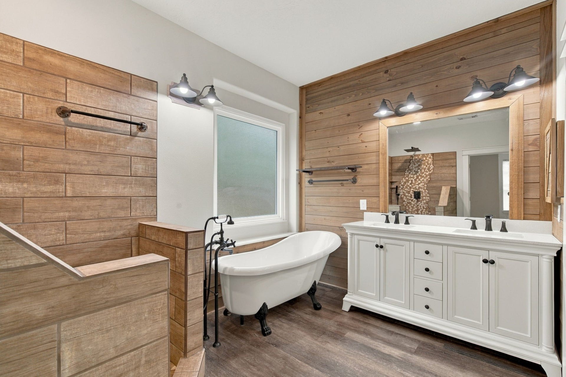 12843 Sherlock Acres Drive, Tomball, TX 77377 Stunning primary bathroom with dual sinks, a soaking tub, and dual walk-in closets.