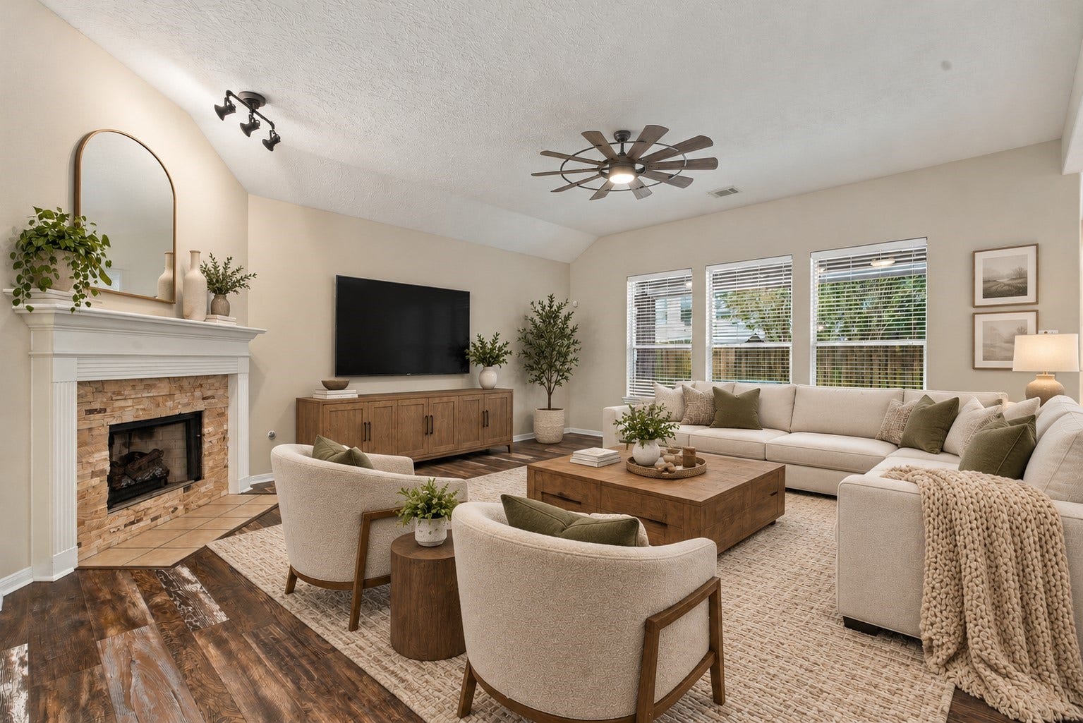 12843 Sherlock Acres Drive, Tomball, TX 77377 Spacious living room with a cozy fireplace and overlooks the backyard. (Virtually Staged)