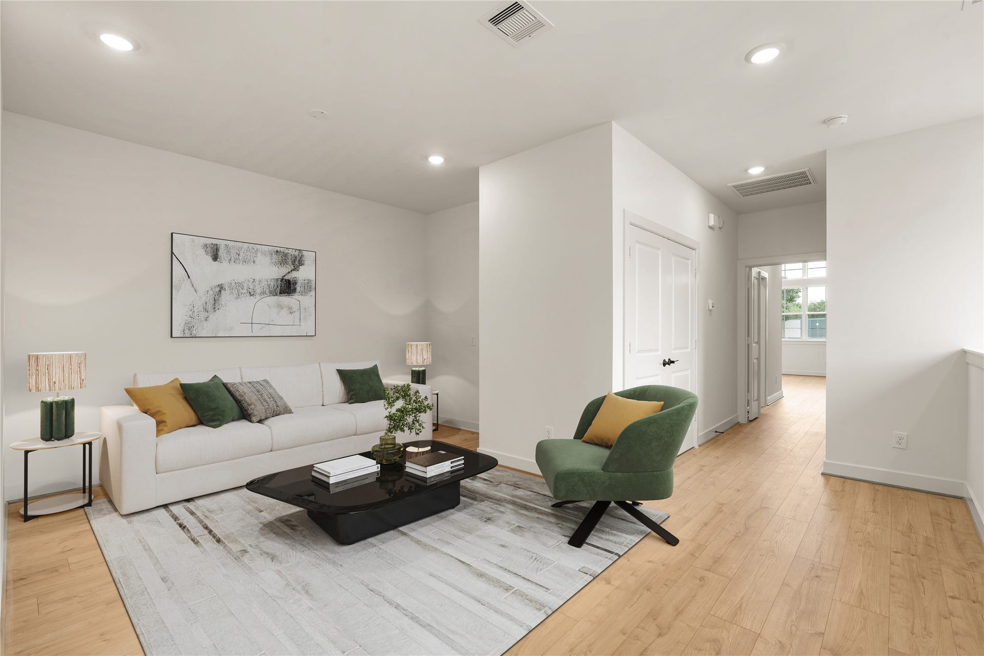 5018 Schuler Street, Houston, TX 77007 Versatile upper-level loft neutral sofa, modern accent chair, plush patterned area rug, and smooth wide-plank floors creating a cozy secondary living space.