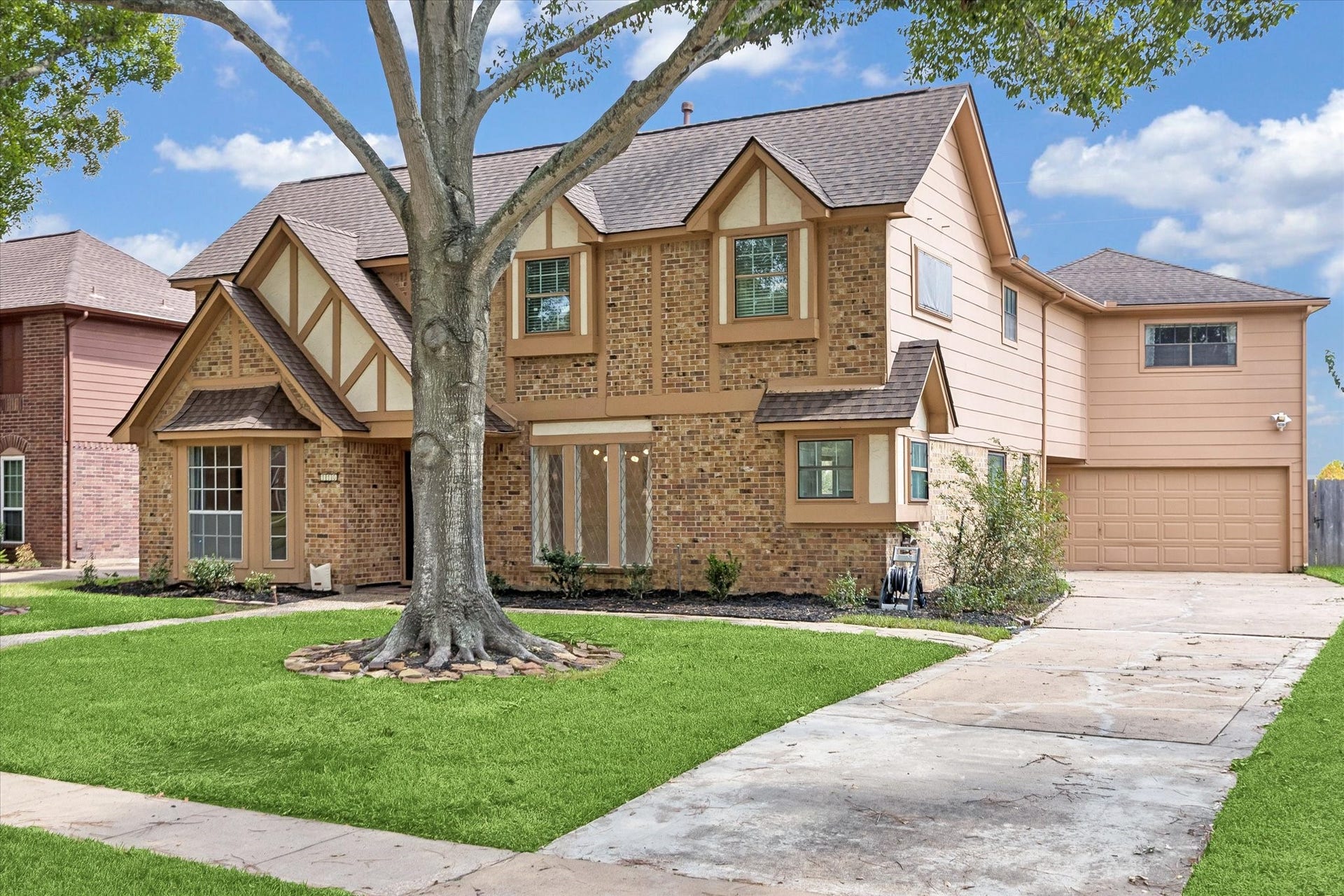 110 Shadow Wood Drive, Sugar Land, TX 77498 Another view of the home showcasing the bay windows and long driveway.