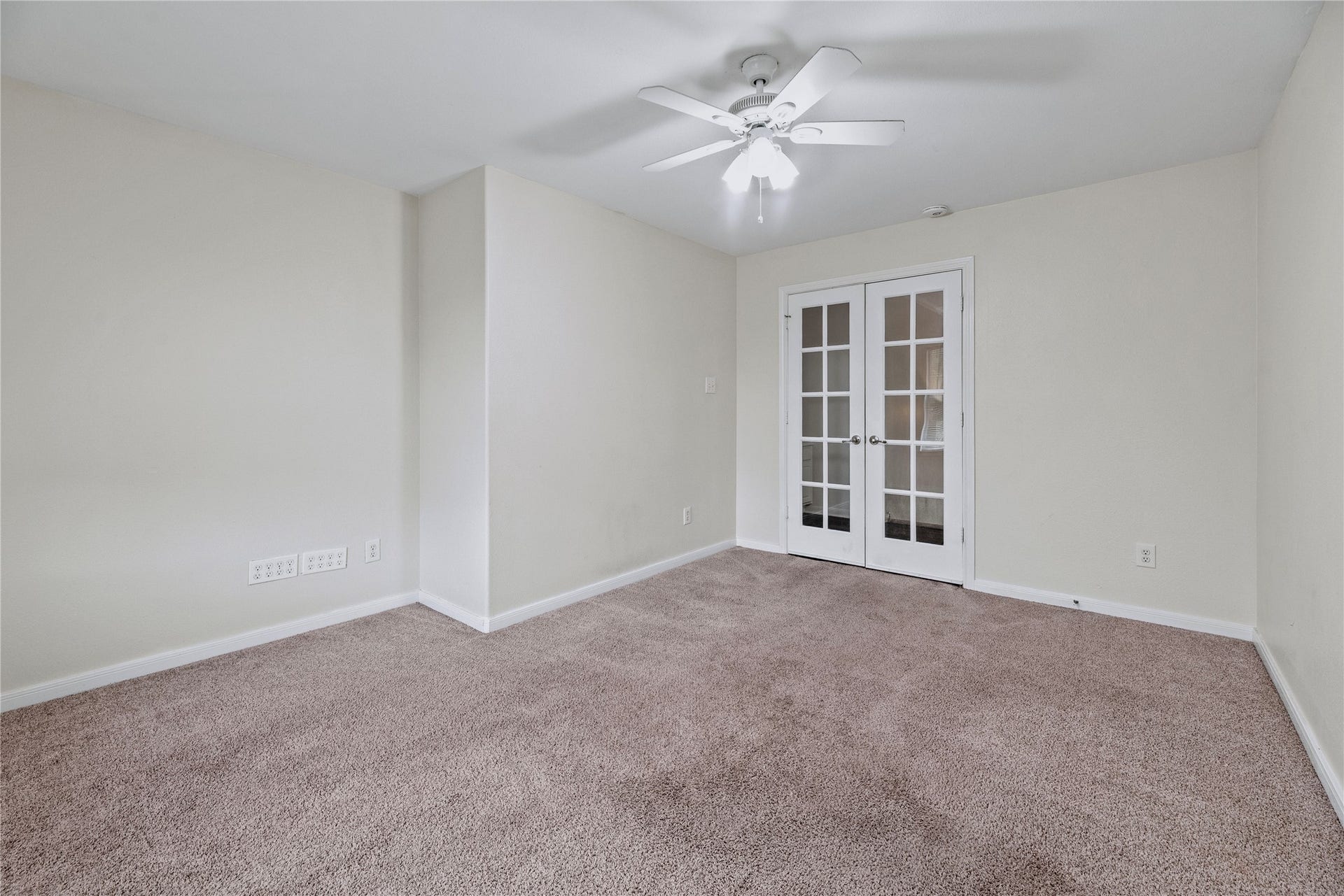 French doors give this room a distinct connection to the upstairs hall, offering a flexible setting for a home office, lounge or other everyday use.