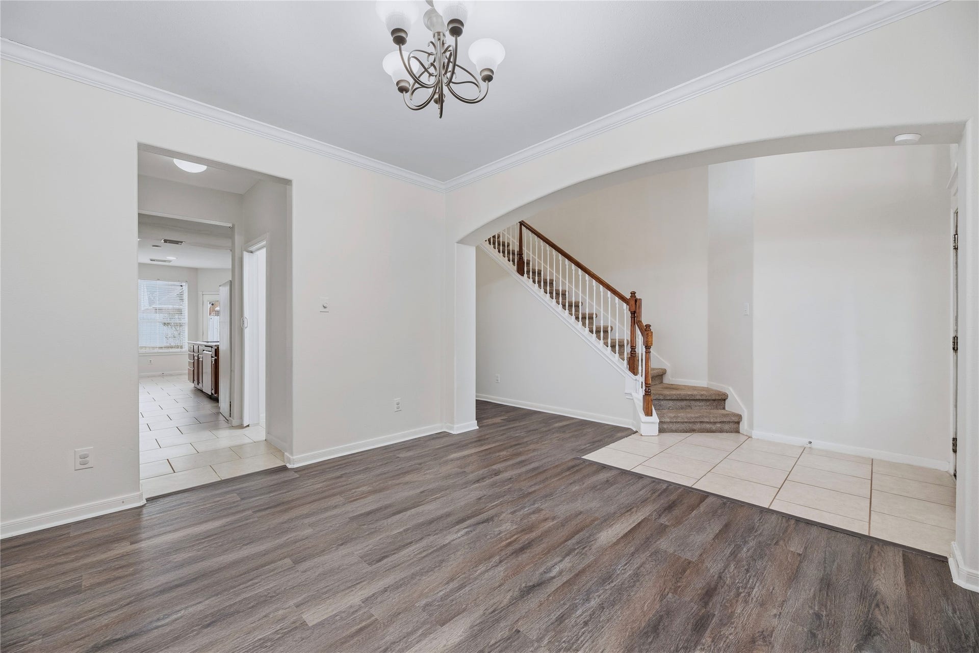 This unfurnished view shows the front living area and its open connection to the entry, giving you a clear look at the layout before planning your furniture.