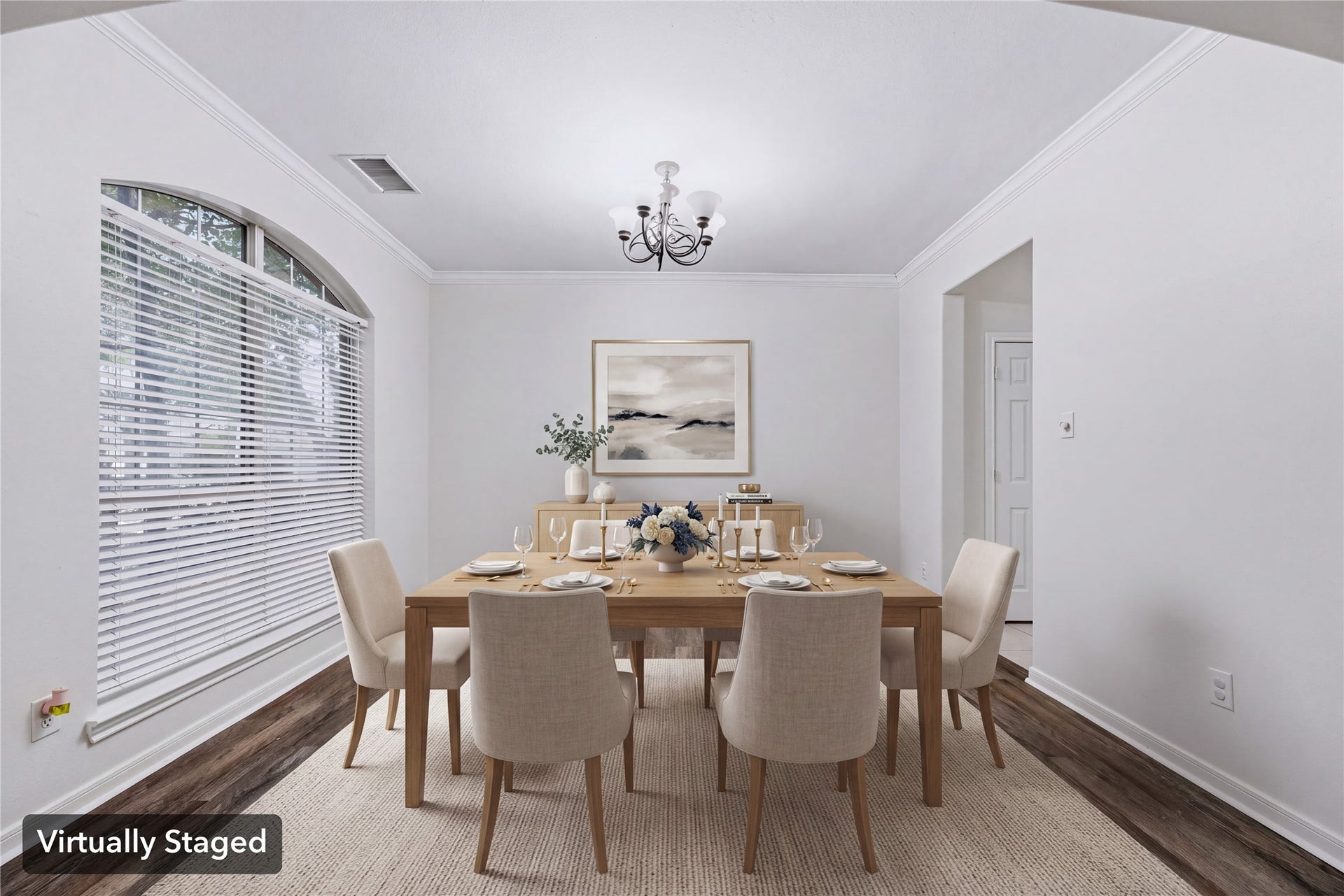 Virtually staged to show a dedicated dining setup beside the large front window, separate from the breakfast area. Furniture shown is digital.