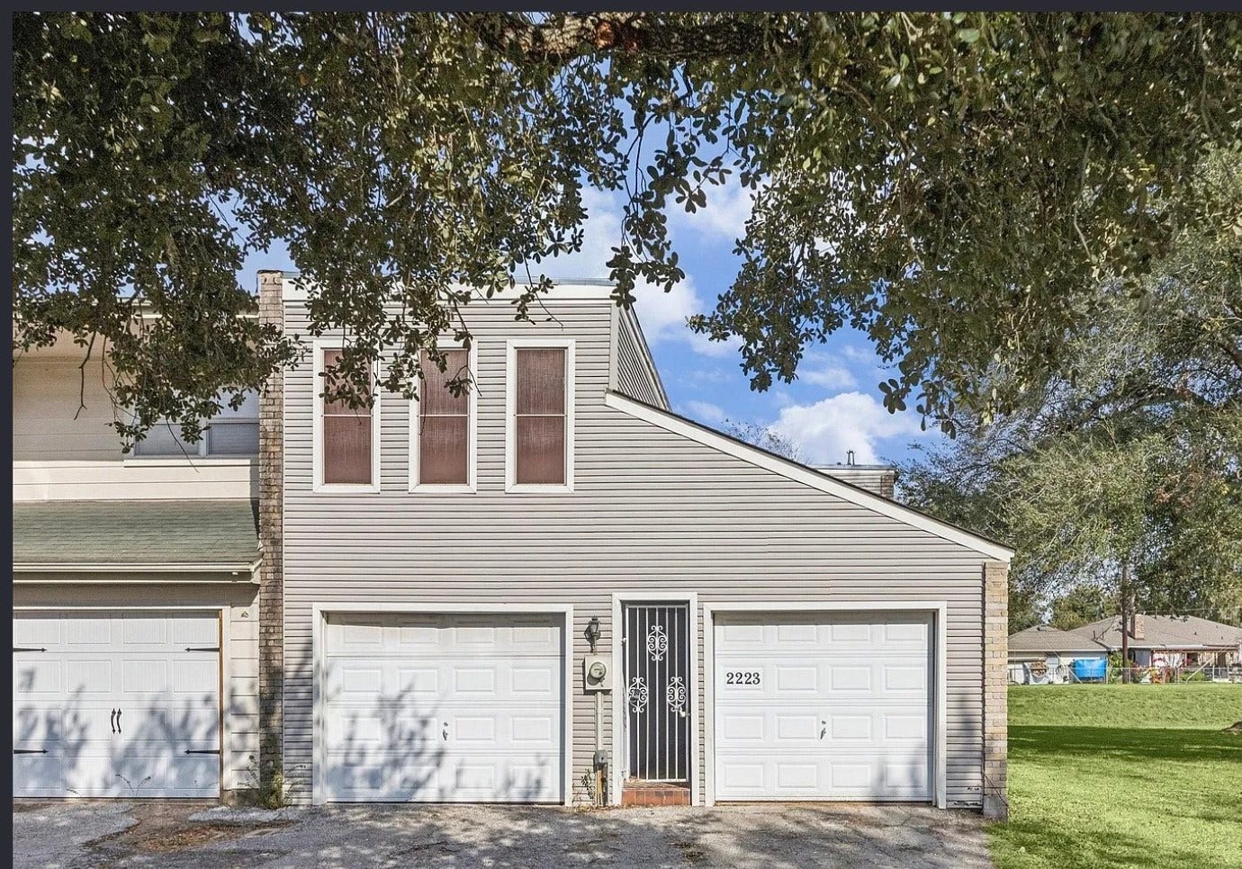 2223 Par Lane, Richmond, TX 77469 2223 Par Ln - Two-story Golfcrest townhome with attached garage and side green space.