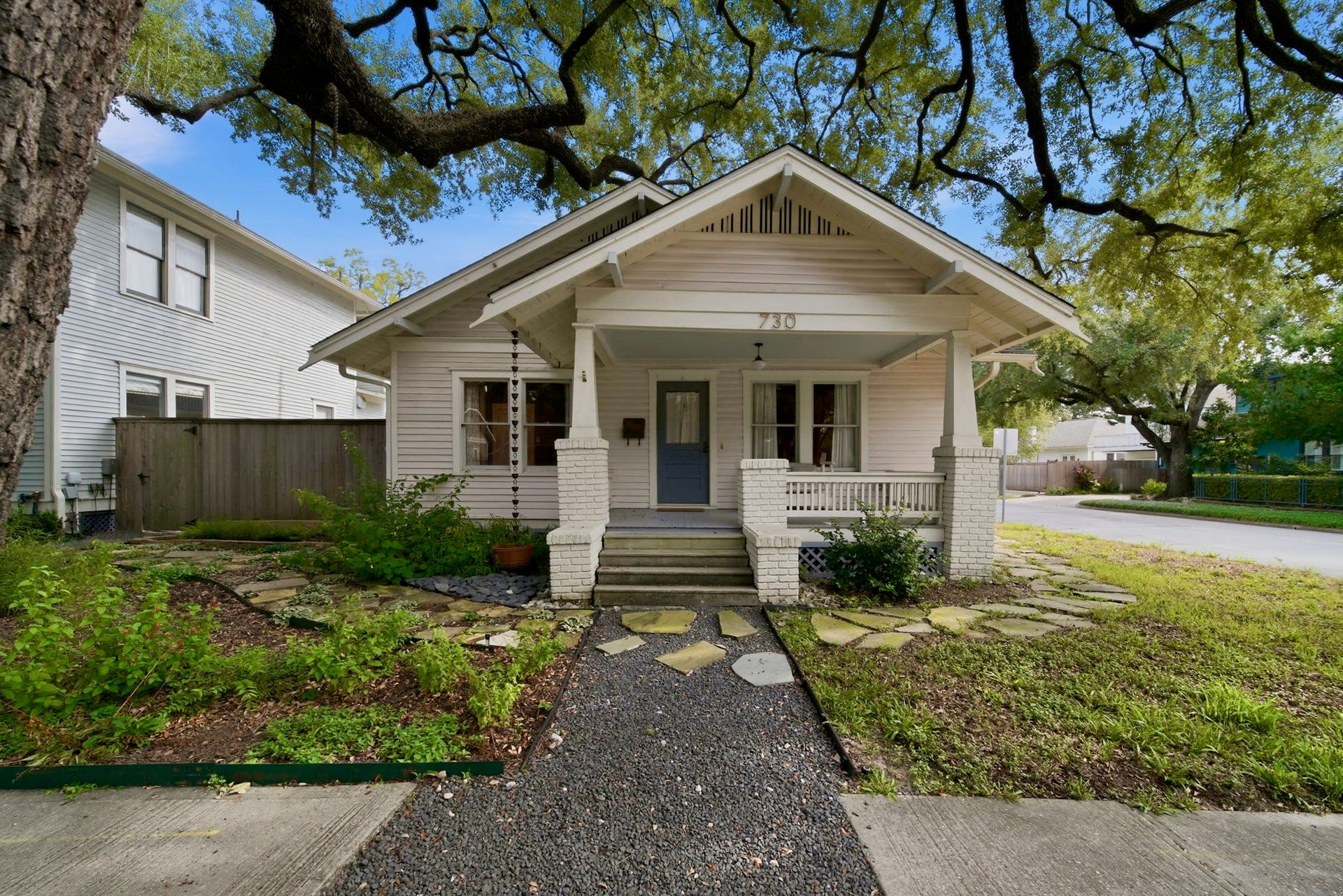 Welcome to 730 Bayland - a picture perfect pinkish bungalow