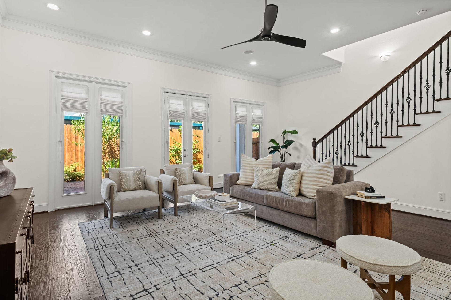 This wide perspective showcases the impressive scale of the first-floor living area. Direct access to the covered loggia extends the entertaining possibilities outdoors.