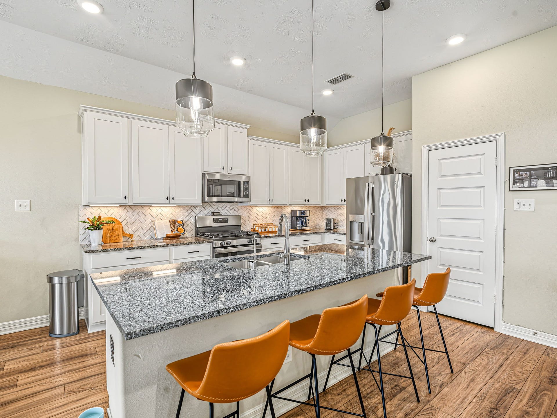 The expansive island offers plenty of supporting prep space as well as room to grab a bite and gather.