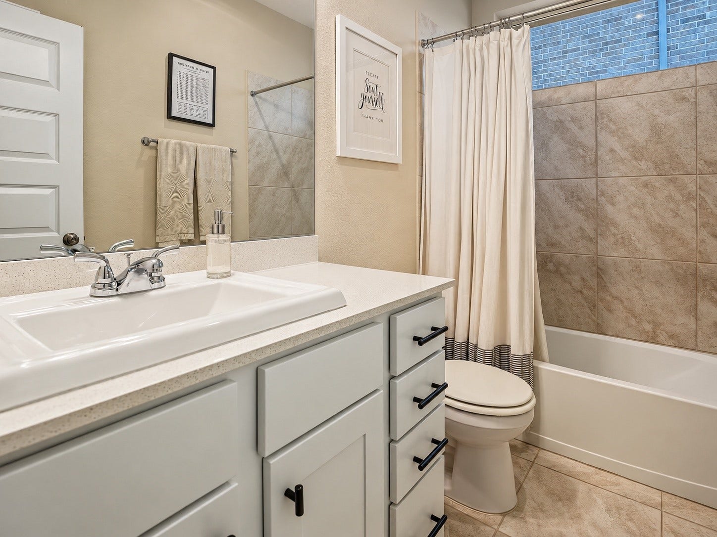 Jack & Jill style guest bath services guests and two secondary bedrooms.