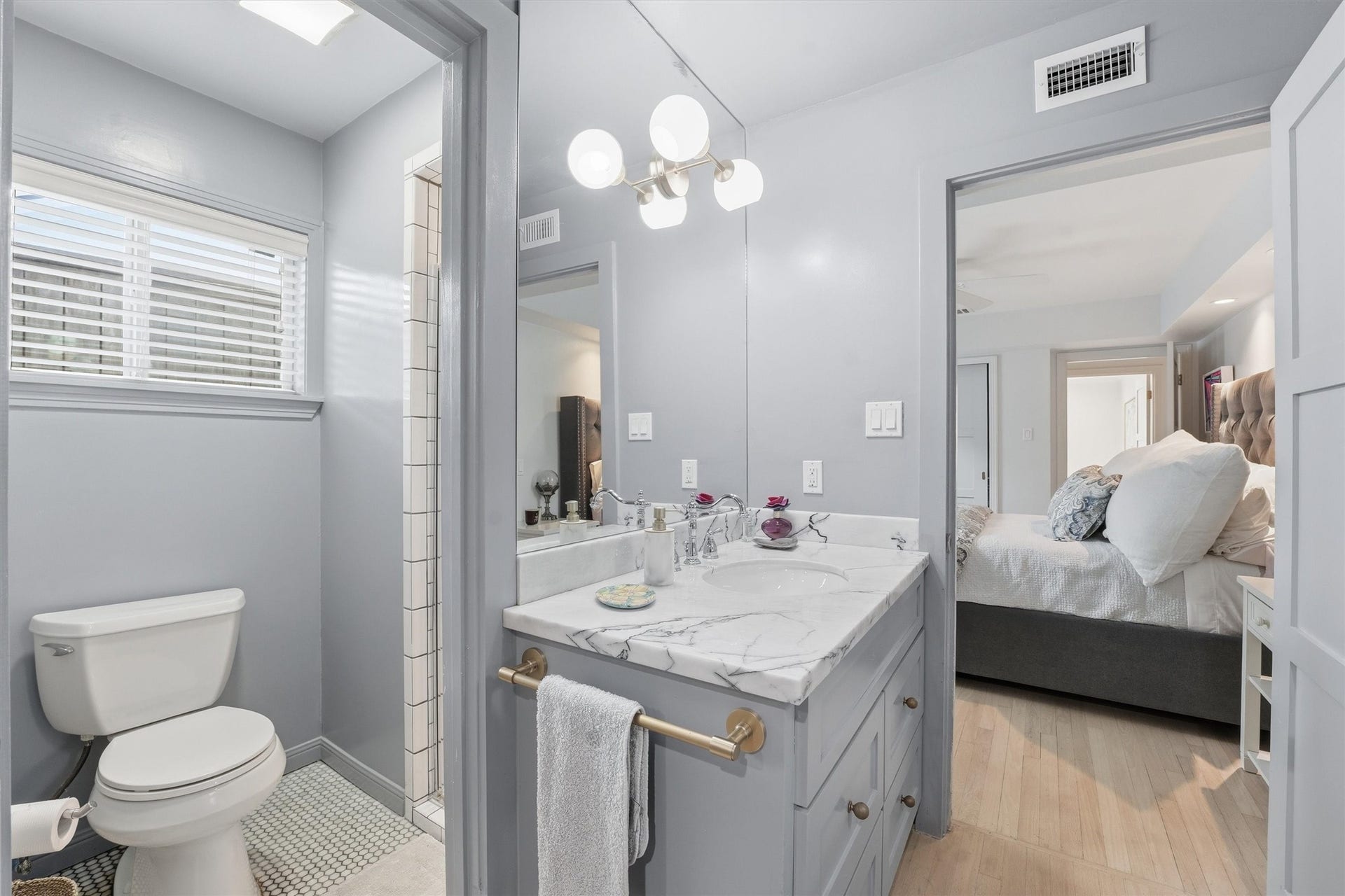 1006 Prince Street, Houston, TX 77008 Primary bath, vanity, closet and laundry are all together - accessible only through the primary bedroom.