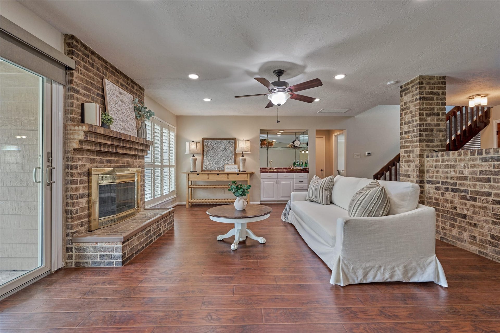 5823 Fair Forest Drive, Houston, TX 77088 A cozy fireplace creates the perfect setting for relaxing evenings at home.