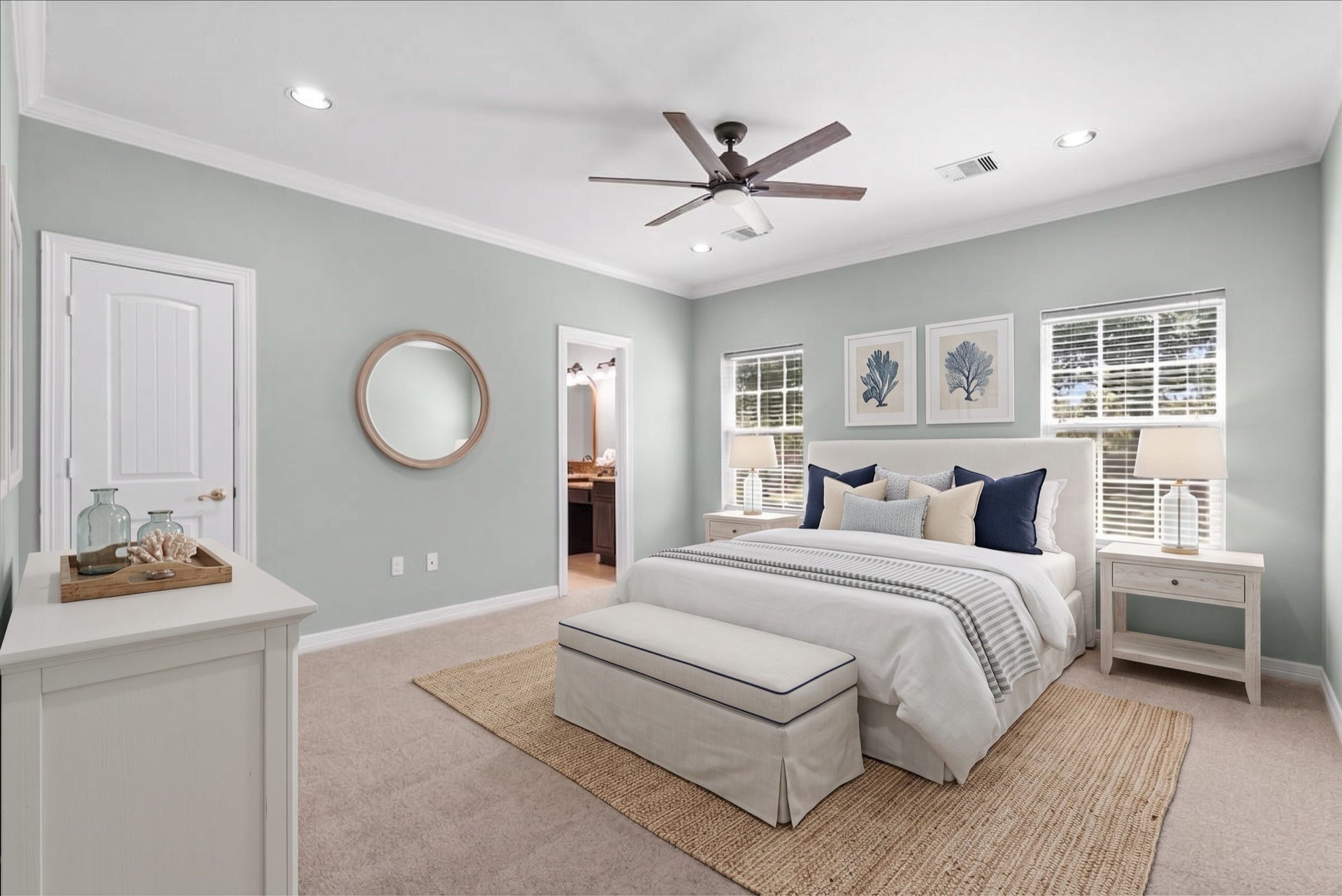 15531 Maple Street, Santa Fe, TX 77517 The primary suite offers new carpet, crown molding, and a ceiling fan, with dual windows filling the room with natural light. An en-suite bathroom connects directly, and a walk-in closet completes the space.