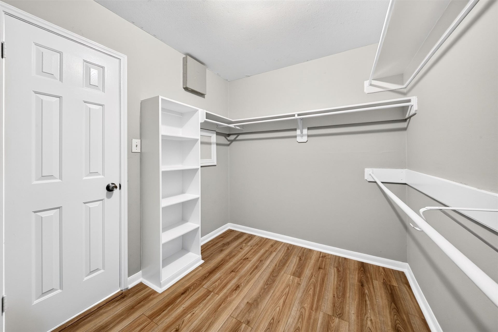 2130 Autumn Fern Drive, Katy, TX 77450 Walk-In Closet
Generously sized walk-in closet featuring built-in shelving, multiple hanging areas and attractive wood-look flooring, providing ample space for organized storage.