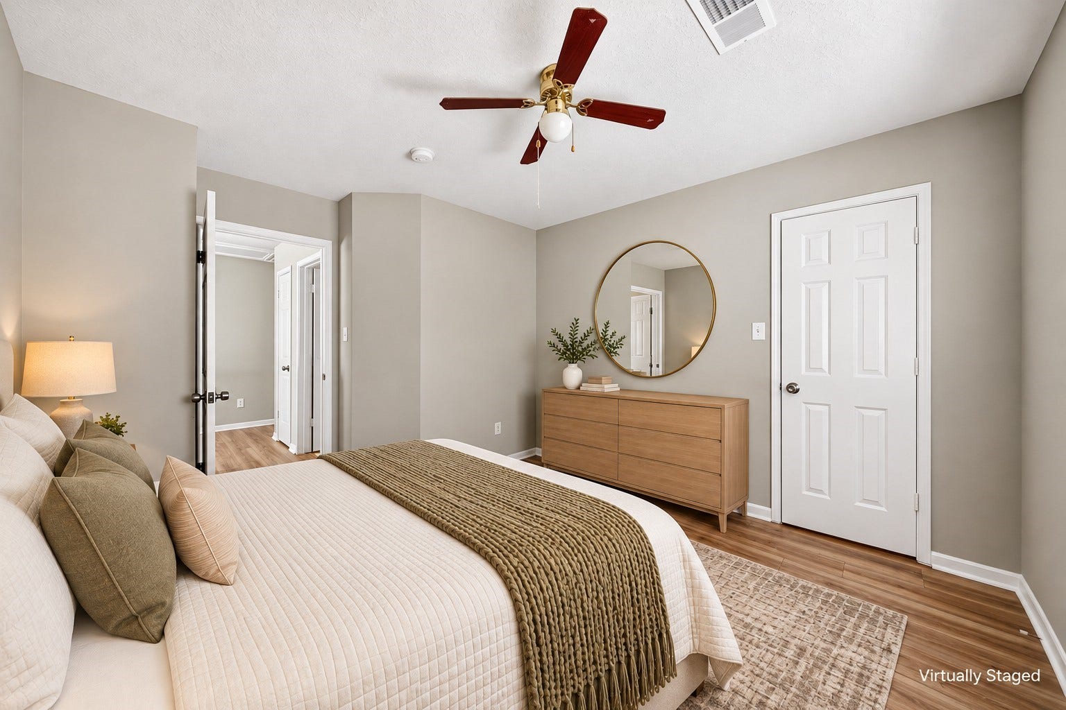 2130 Autumn Fern Drive, Katy, TX 77450 Secondary Bedroom: Comfortable secondary bedroom with wood-look flooring, ceiling fan, closet access and flexible space for furnishings.