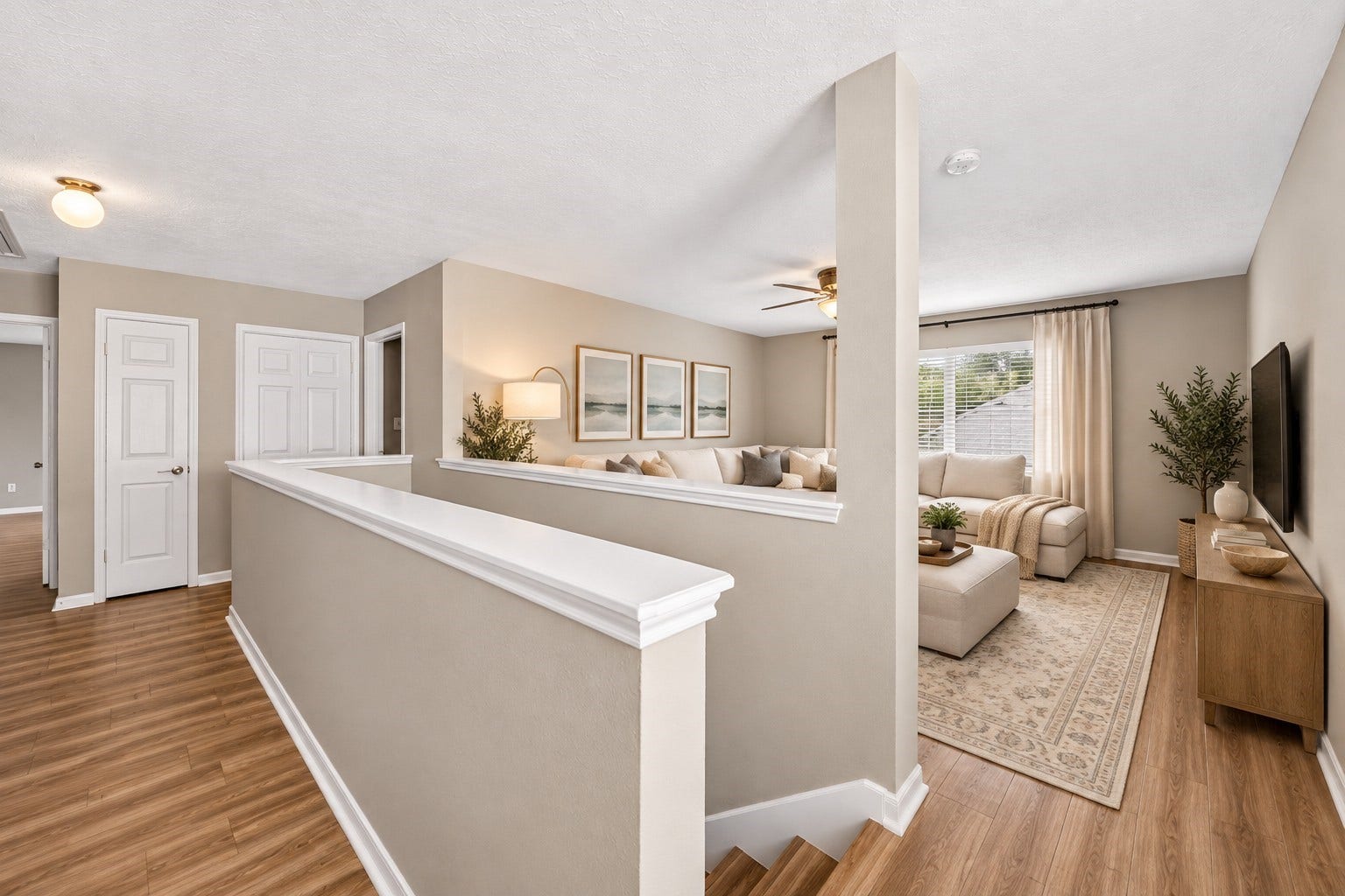 2130 Autumn Fern Drive, Katy, TX 77450 Upstairs Loft / Additional Living Area: Spacious upstairs living area features beautiful wood-look flooring, abundant natural light and an open, versatile layout, offering an inviting space for relaxation, entertainment or a media room.