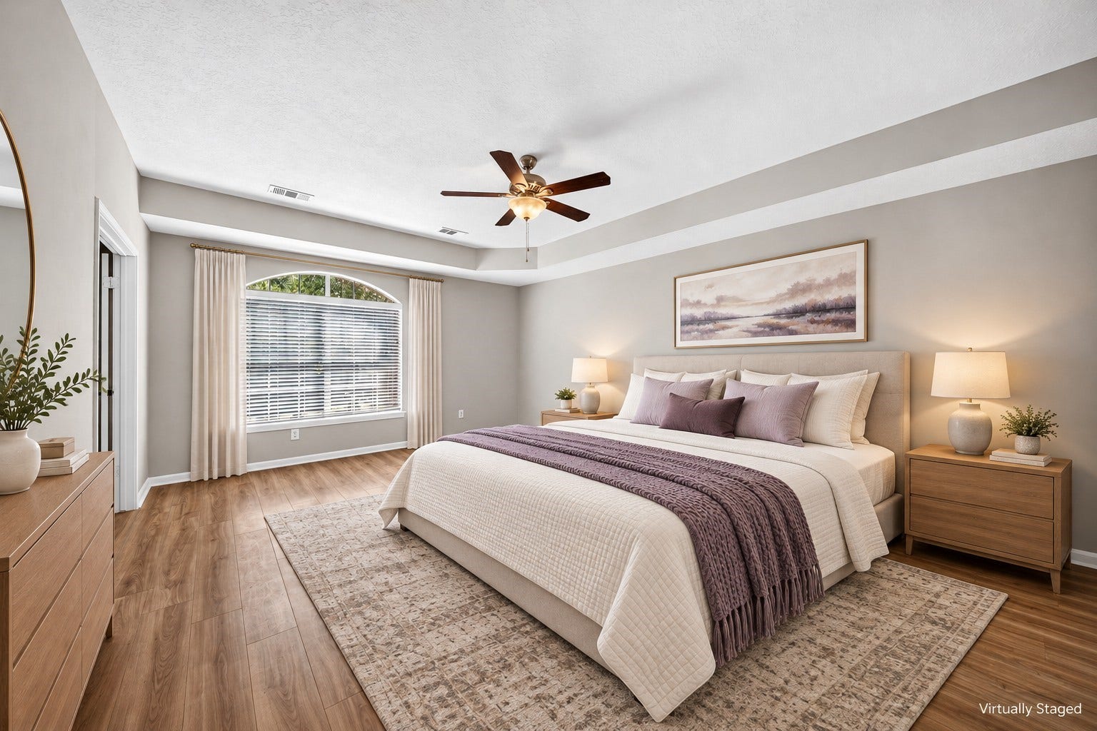 2130 Autumn Fern Drive, Katy, TX 77450 Primary Bedroom Alternate View: Beautiful arched window welcomes abundant natural light into the spacious primary suite, complemented by a tray ceiling and neutral interior finishes.