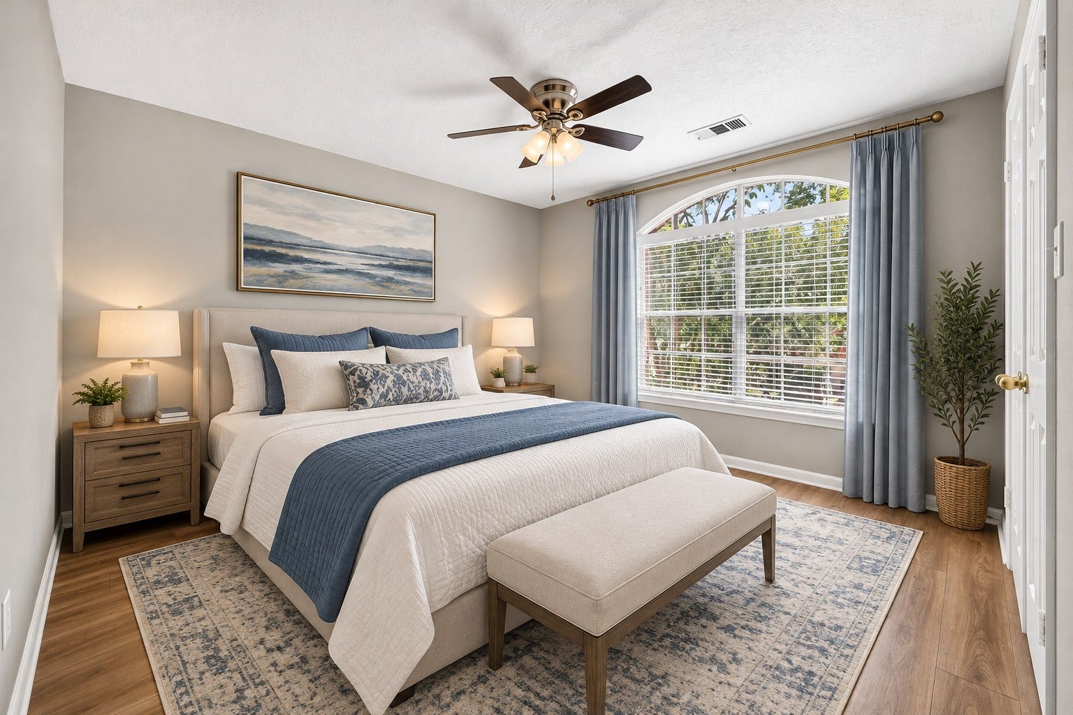 2130 Autumn Fern Drive, Katy, TX 77450 Secondary Bedroom Alternate View: An inviting secondary bedroom highlighted by a beautiful arched window, abundant natural light and warm wood-look floors.