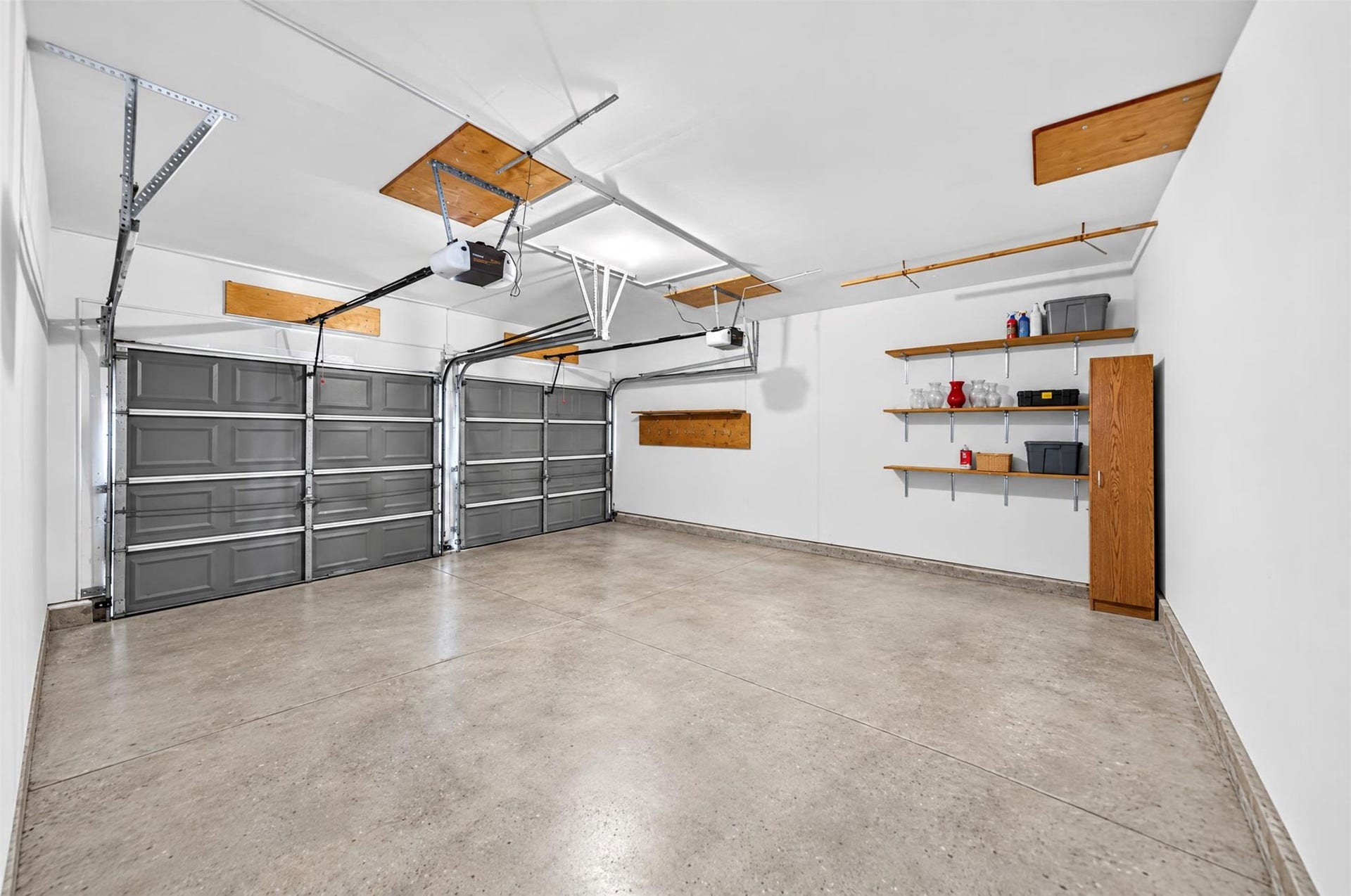 2130 Autumn Fern Drive, Katy, TX 77450 Attached Two-Car Garage
Spacious attached two-car garage features dual garage doors with automatic openers, built-in wall shelving and additional storage space for everyday convenience.