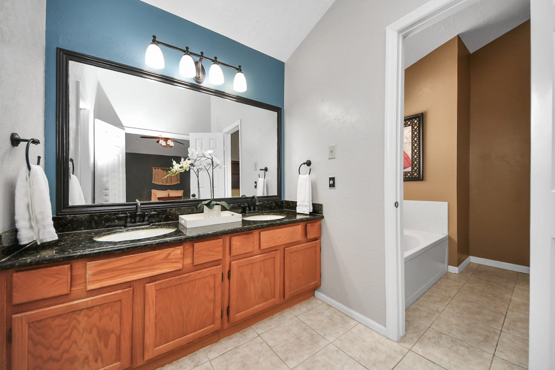 7615 Park Falls Drive, Houston, TX 77095 Spacious en-suite bathroom features dual sinks and plenty of room for everyday routines