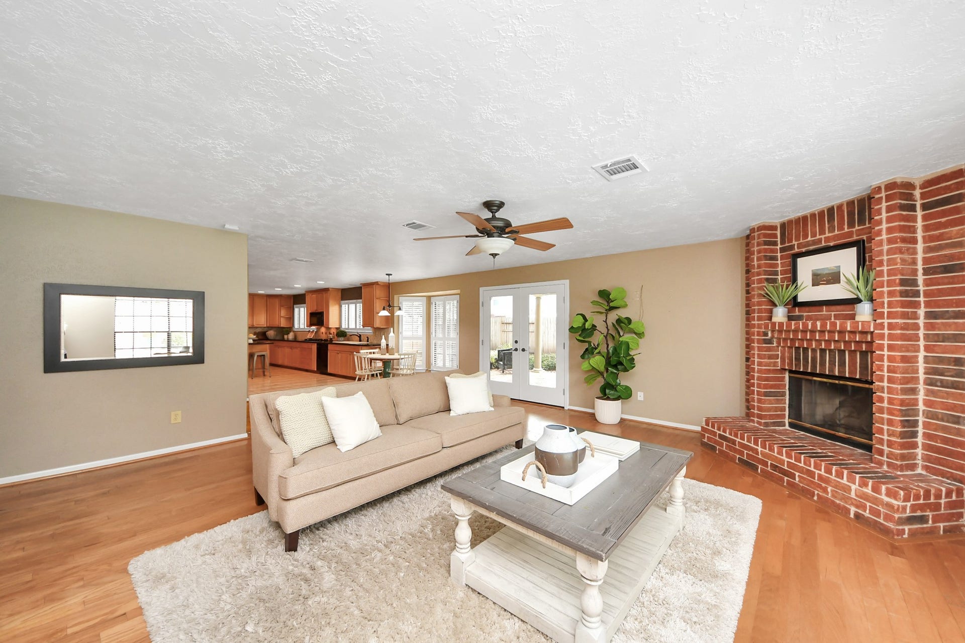 7615 Park Falls Drive, Houston, TX 77095 Spacious living area featuring a cozy fireplace and an inviting layout