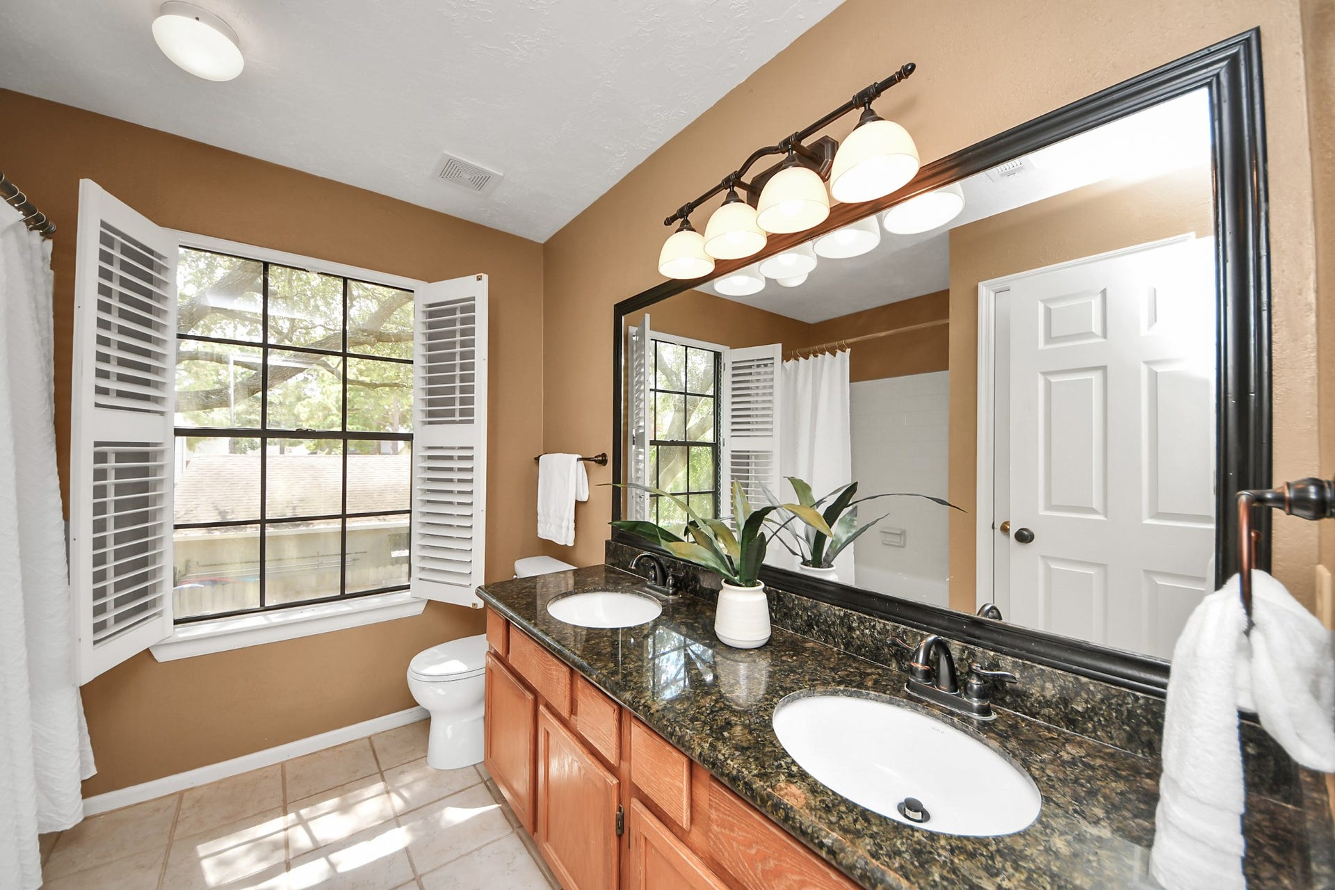 7615 Park Falls Drive, Houston, TX 77095 Charming secondary bathroom features a granite countertop and dual sinks