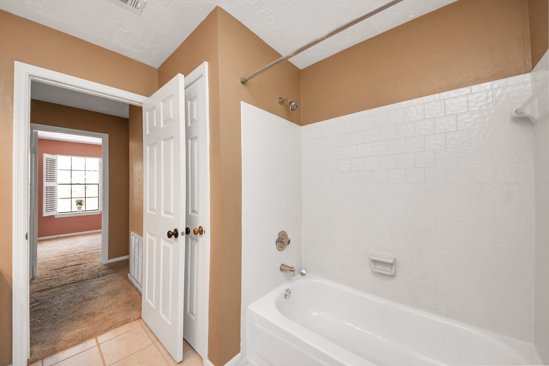 7615 Park Falls Drive, Houston, TX 77095 Shower/tub combination and linen closet provide added convenience and storage