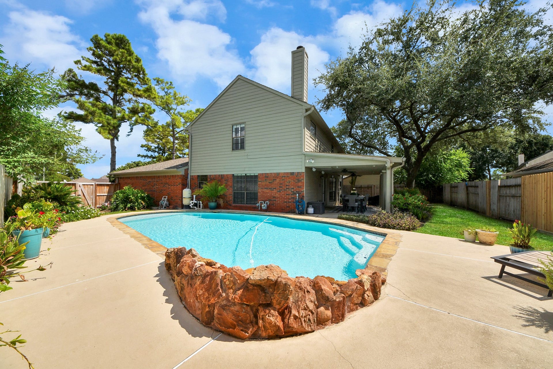 7615 Park Falls Drive, Houston, TX 77095 Resurfaced concrete adds a fresh, updated look to the outdoor living and pool area