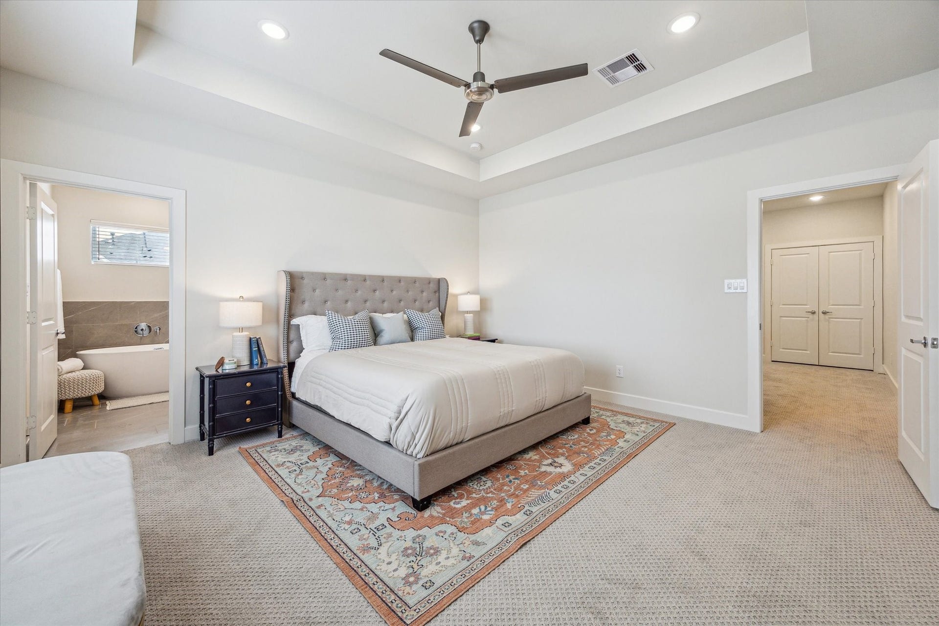 24436 Colonial Commons Drive, Katy, TX 77493 Representative photo showing the communitys model home primary bedroom. Layout and selections may vary.