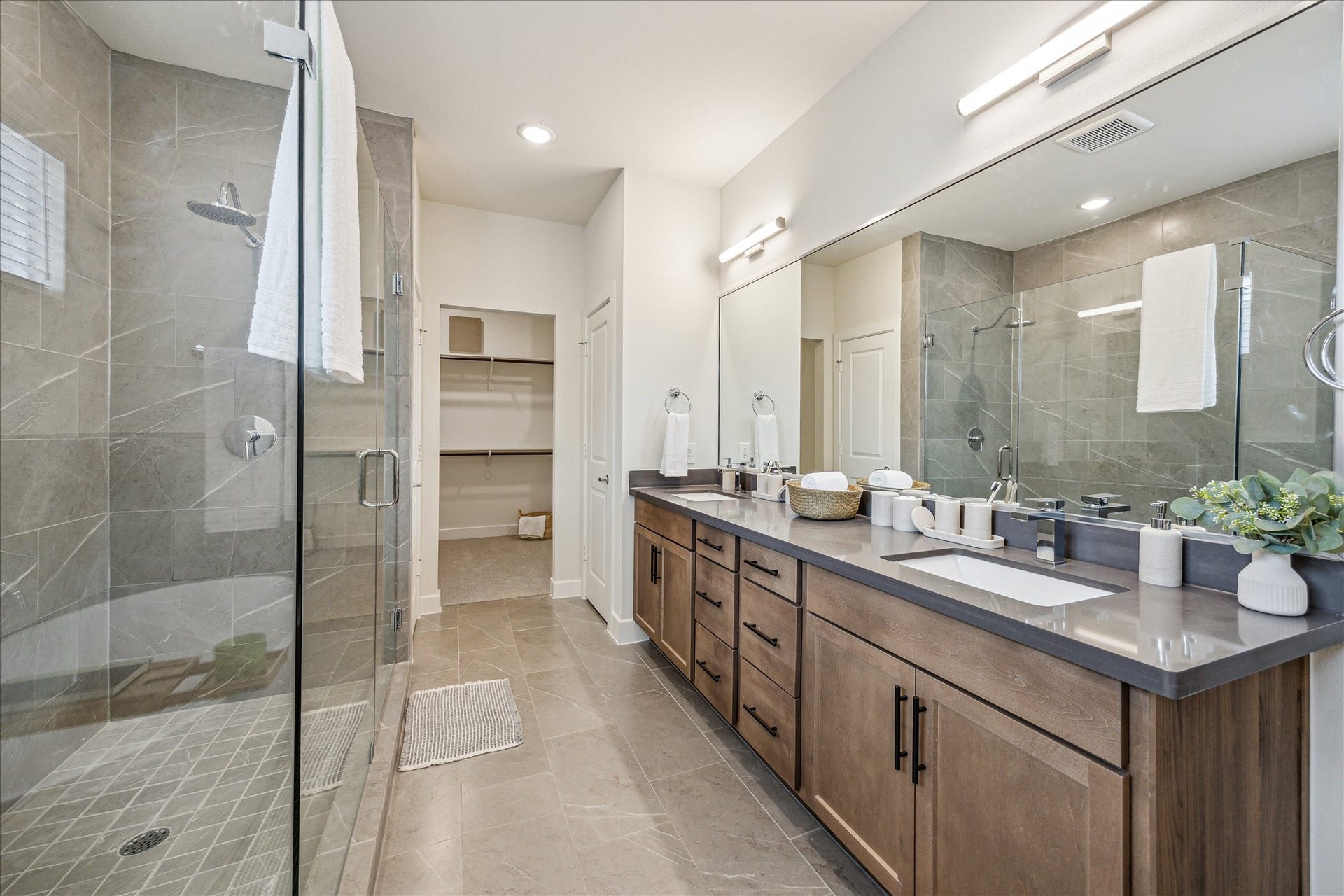 24436 Colonial Commons Drive, Katy, TX 77493 Representative photo showing the communitys model home primary bathroom. Layout and selections may vary.