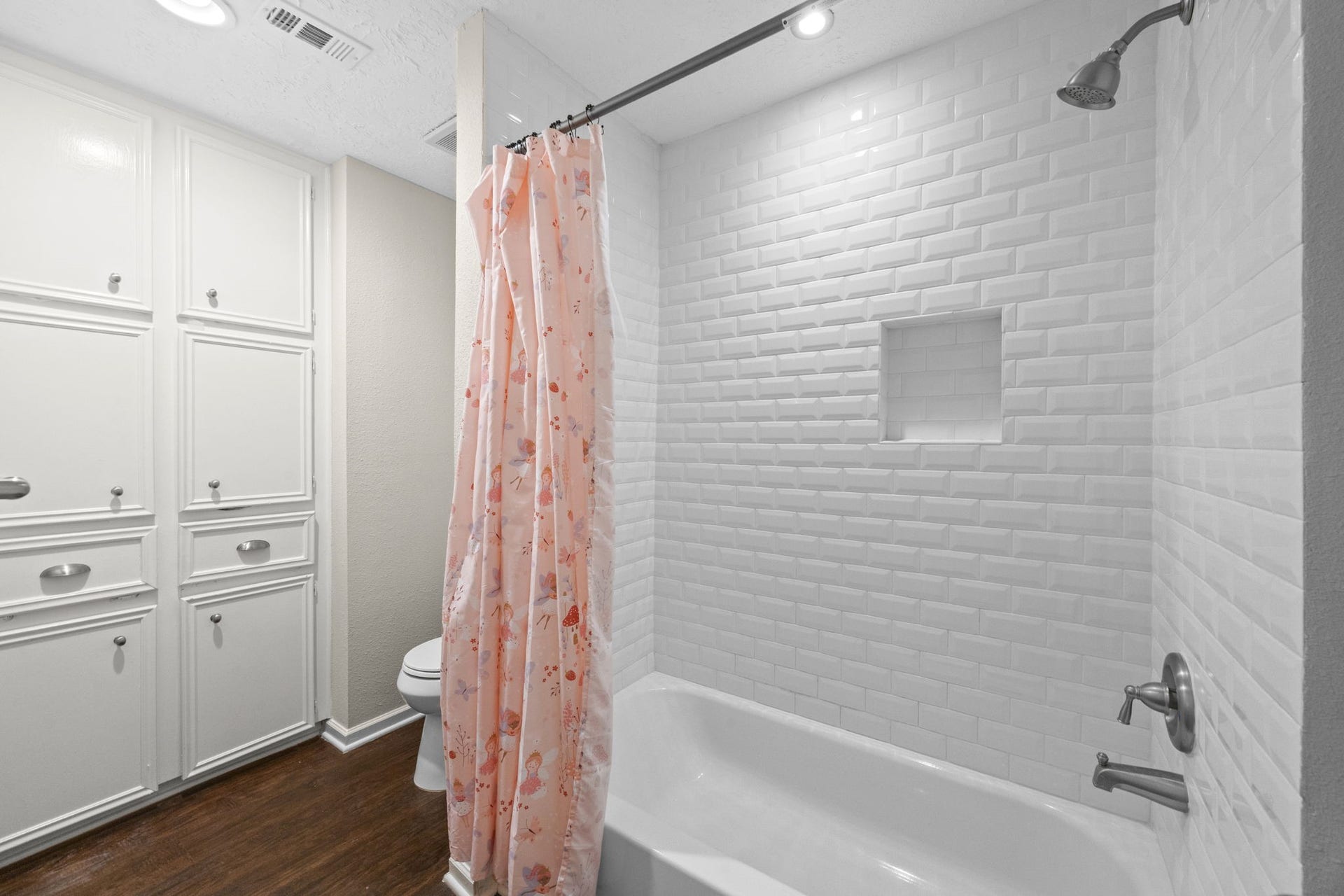 13823 Ivymount Drive, Sugar Land, TX 77498 Updated tile in shower/tub combo in upstairs bathroom, and ample storage.