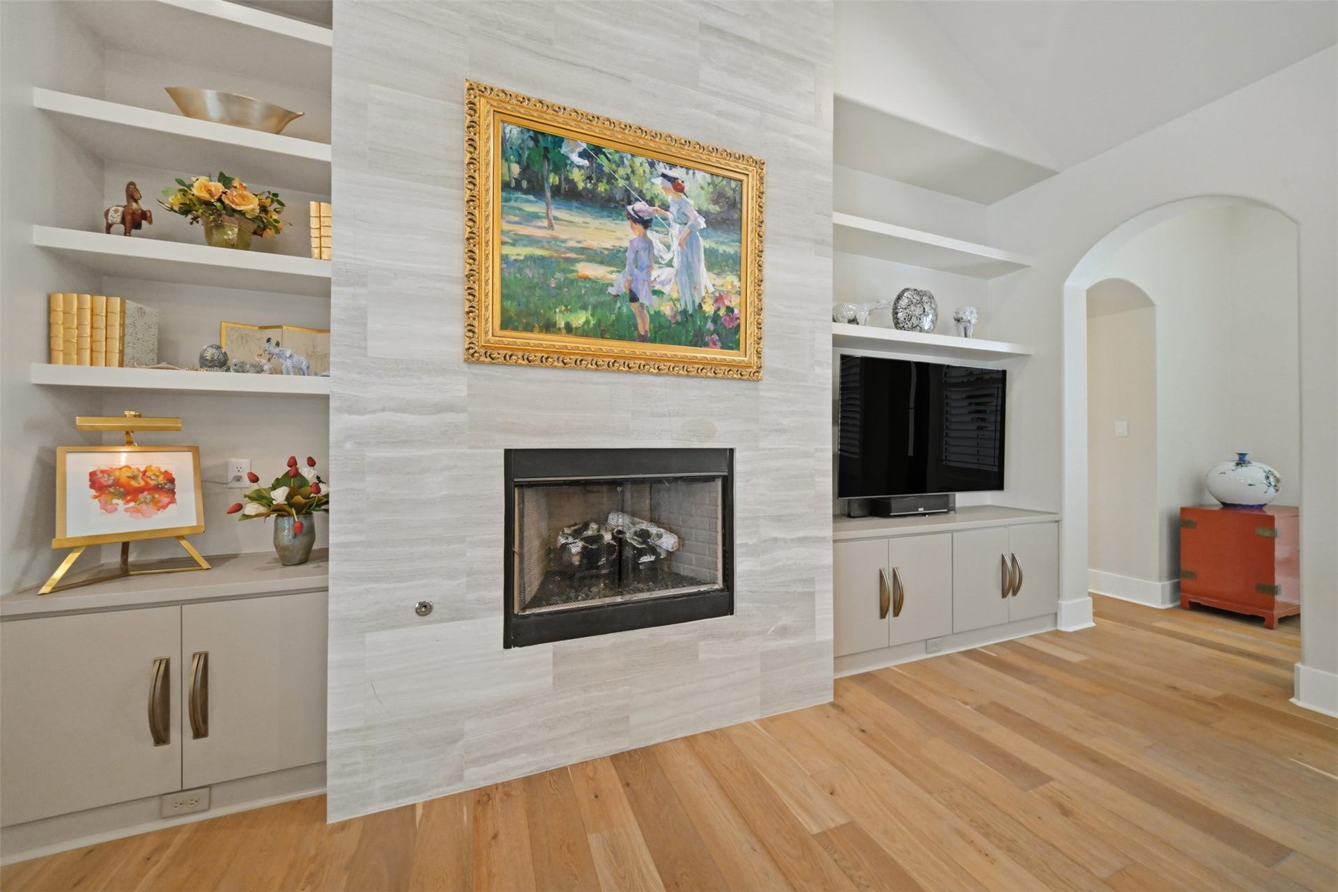 5117 Inverness Drive, Bryan, TX 77802 Great room featuring a gas-log fireplace flanked by custom built-ins and cabinetry.