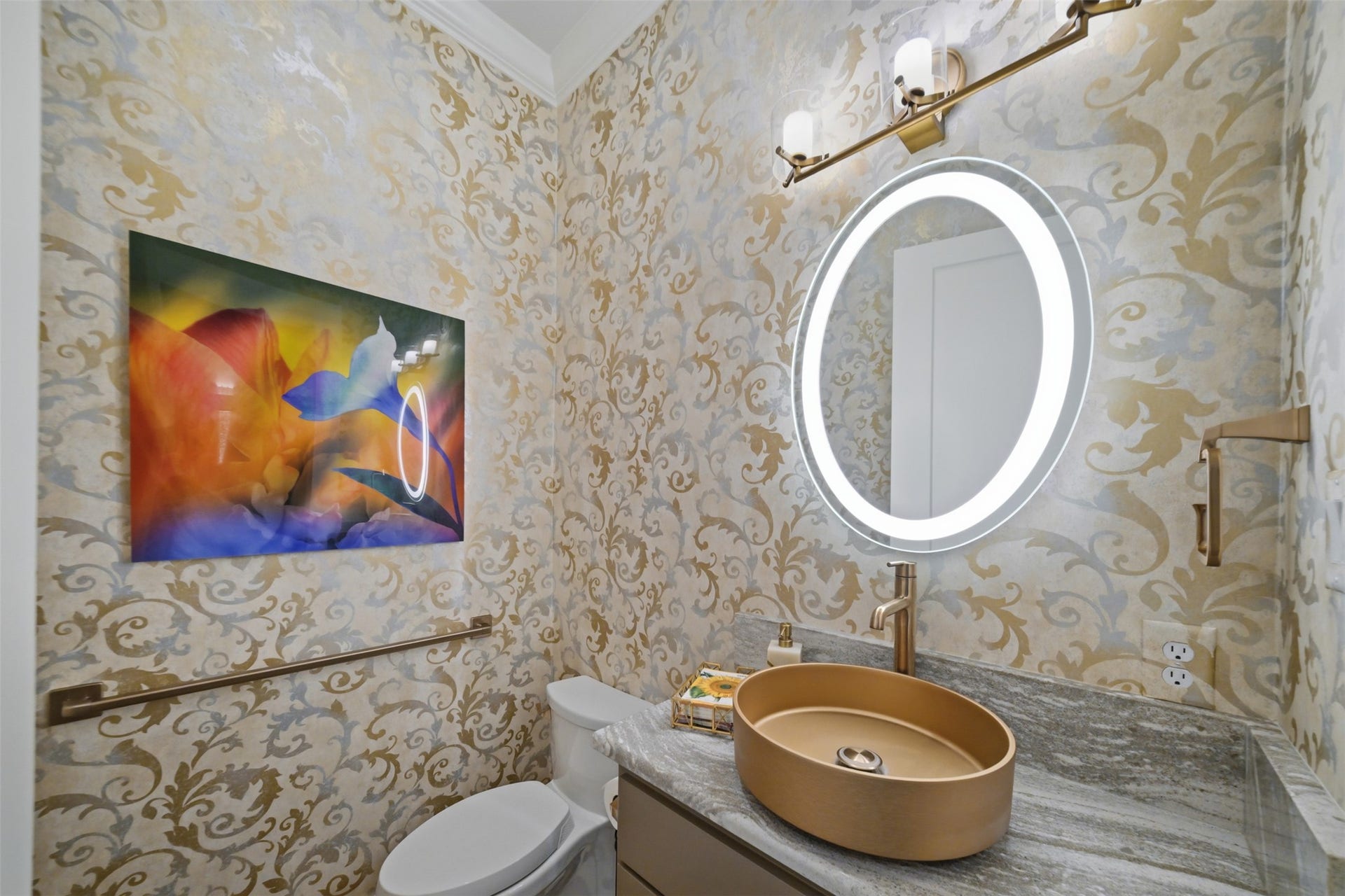 5117 Inverness Drive, Bryan, TX 77802 Stylish powder room featuring a custom vessel sink, illuminated mirror and designer fixtures.