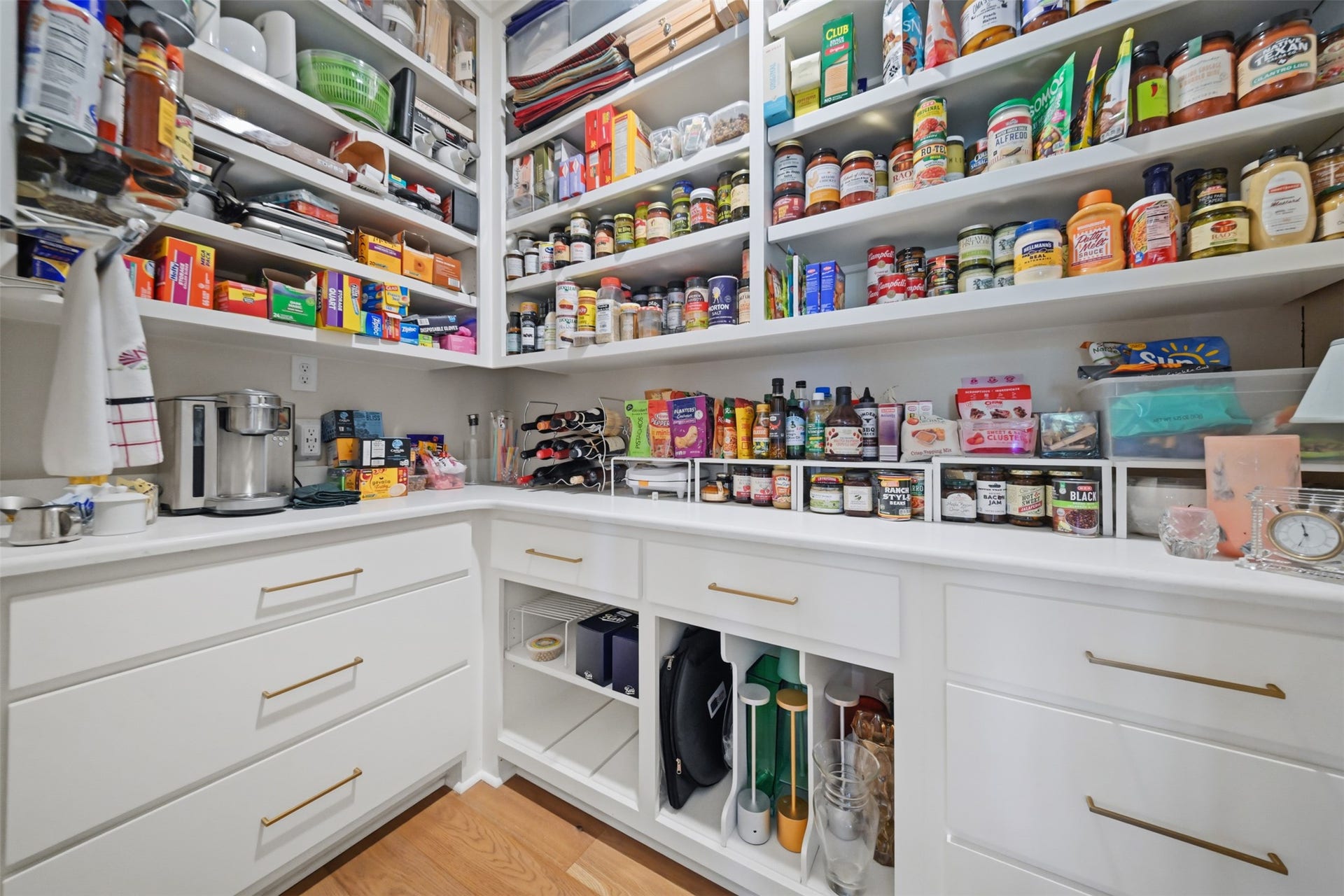 5117 Inverness Drive, Bryan, TX 77802 Butlers pantry offering abundant custom storage and thoughtful organizational features.