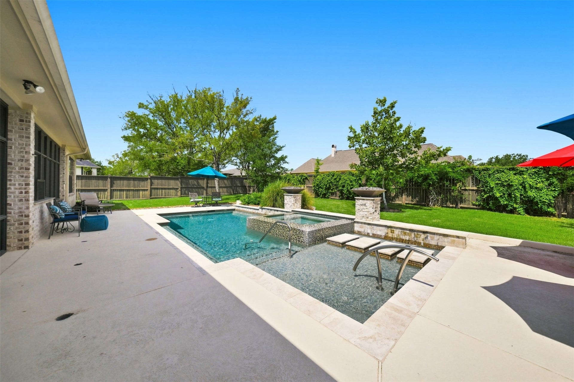 5117 Inverness Drive, Bryan, TX 77802 Resort-style pool with a spacious sun shelf and multiple areas for lounging, relaxing and entertaining.
