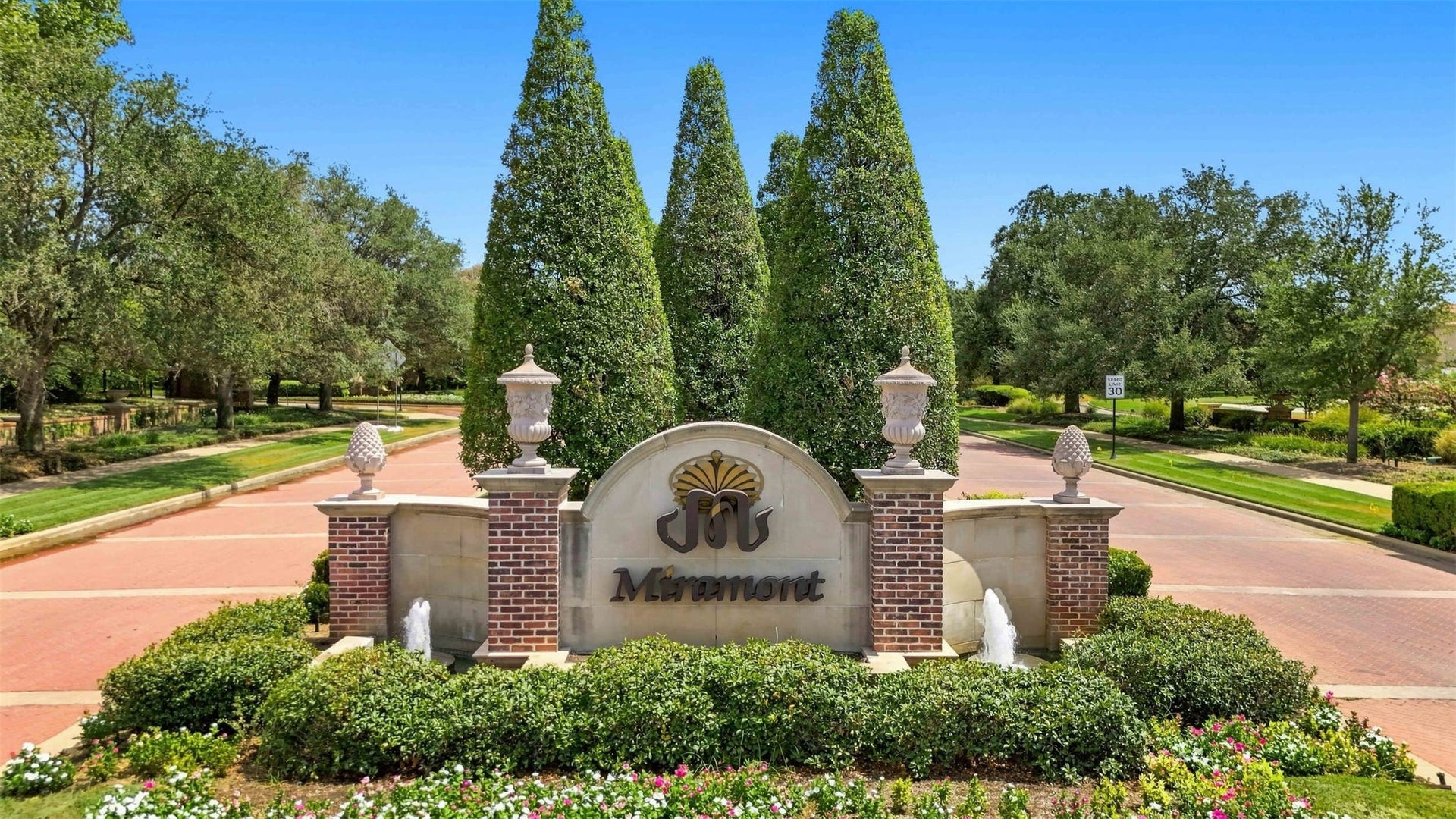 5117 Inverness Drive, Bryan, TX 77802 Beautifully landscaped entrance welcoming you to the prestigious Miramont community
