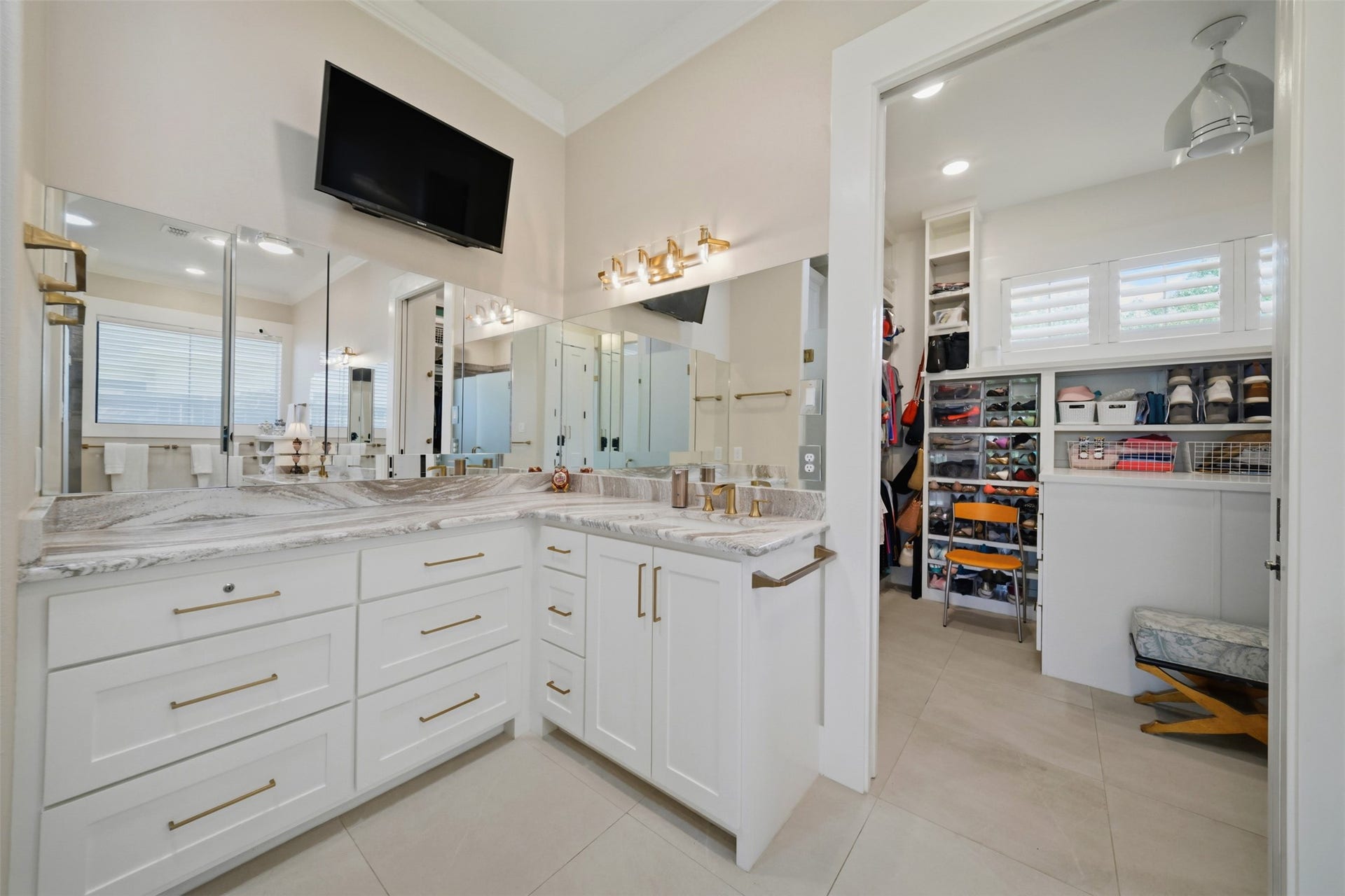 5117 Inverness Drive, Bryan, TX 77802 Primary bath featuring separate vanities with abundant custom cabinetry and storage.