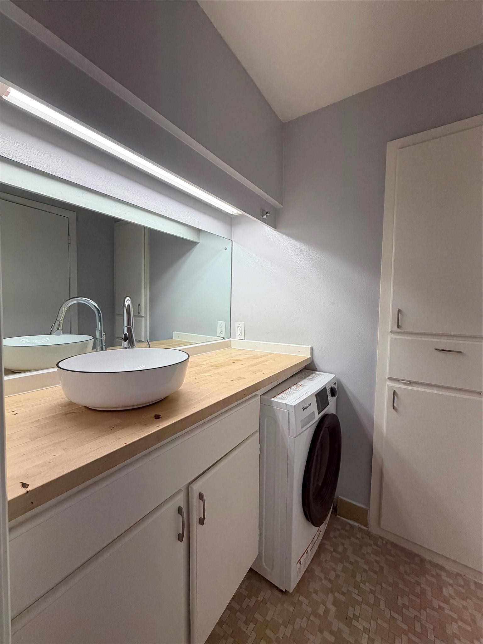 Bathroom with washer/dryer combo