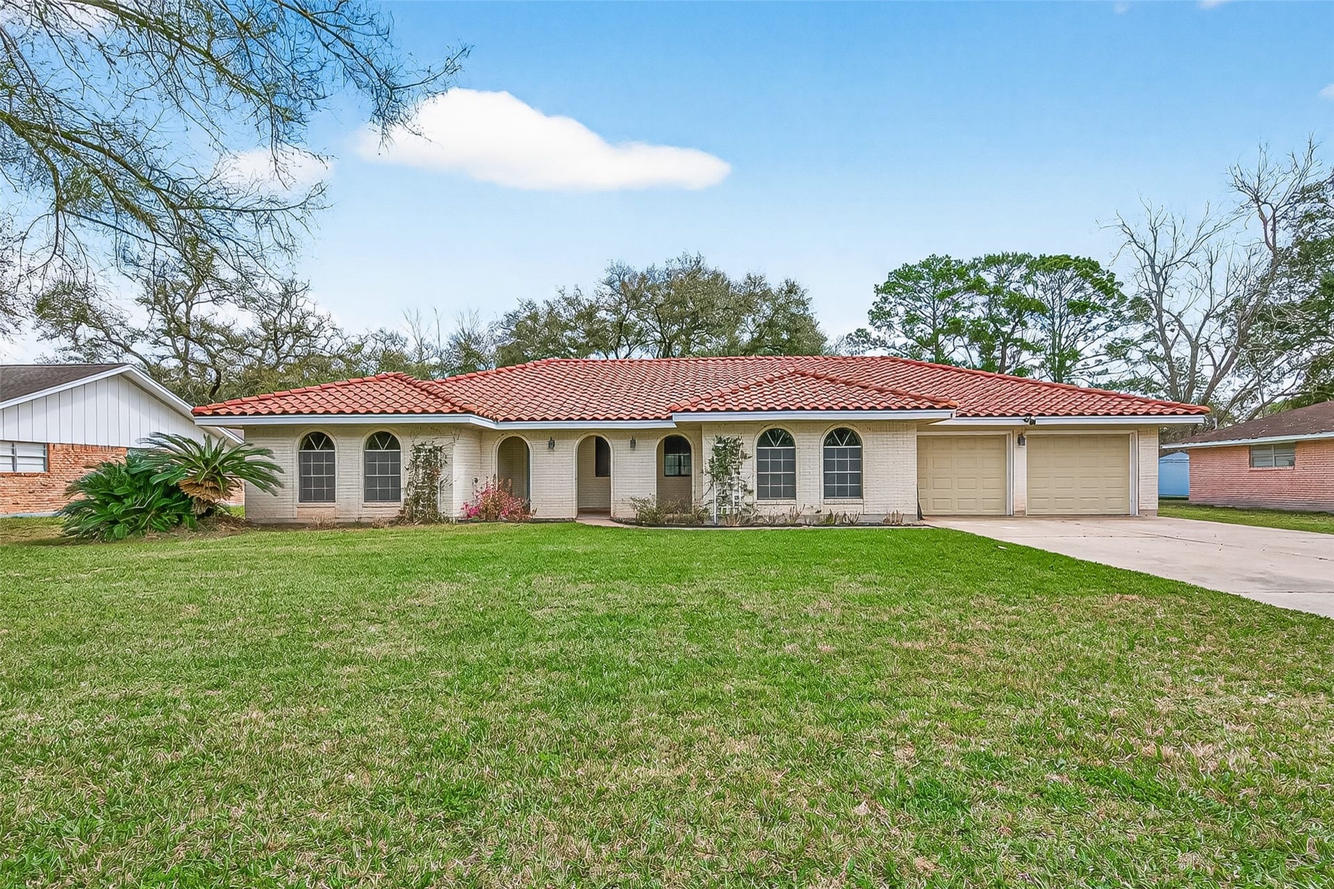 5607 Avenue M 1/2, Santa Fe, TX 77510 Welcome to your new Spanish Colonial Revival style home.