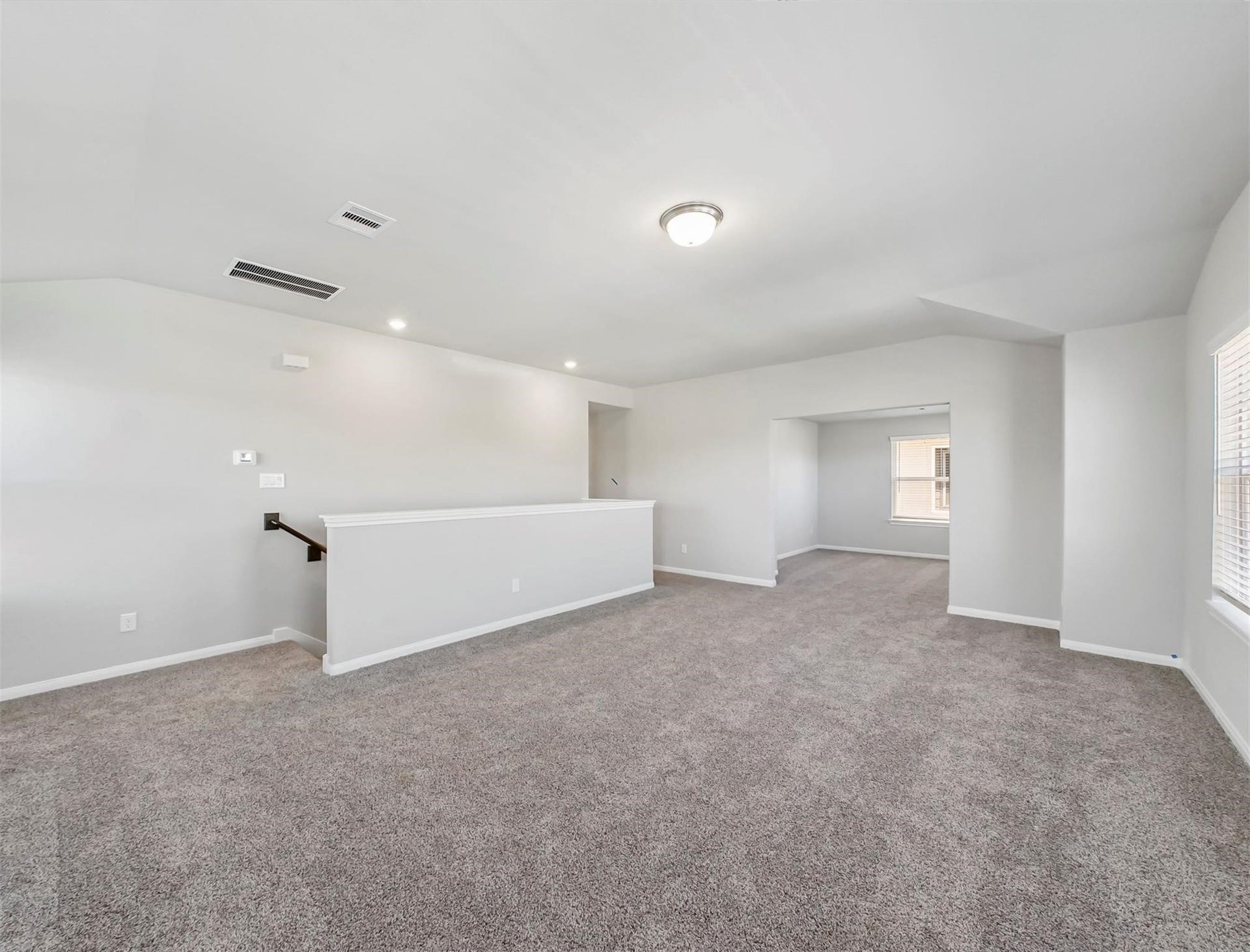 Additional view of the gameroom highlights its open layout and extended space, ideal for multi-functional use or entertaining guests.